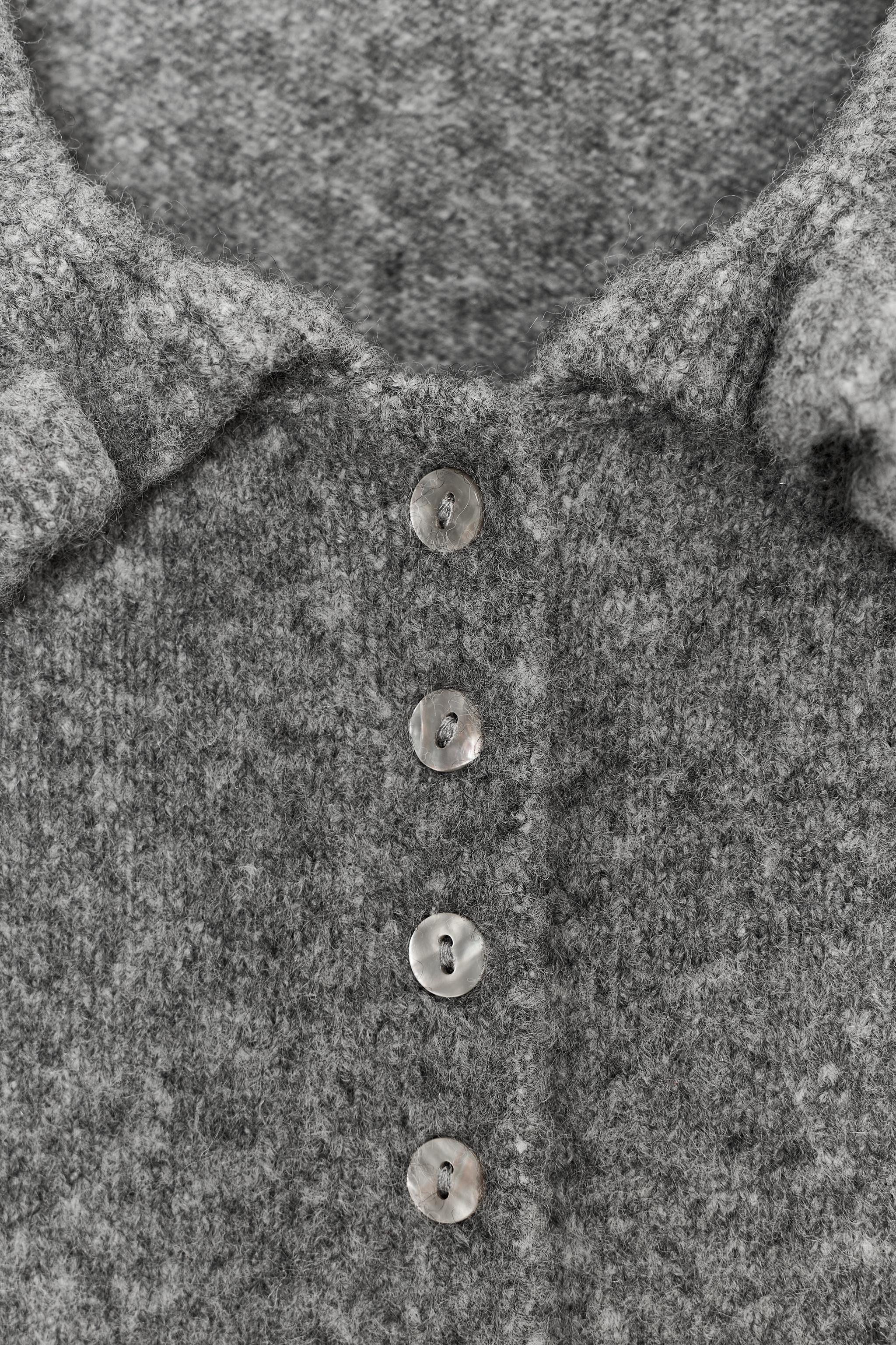 RUFFLED KNIT CARDIGAN