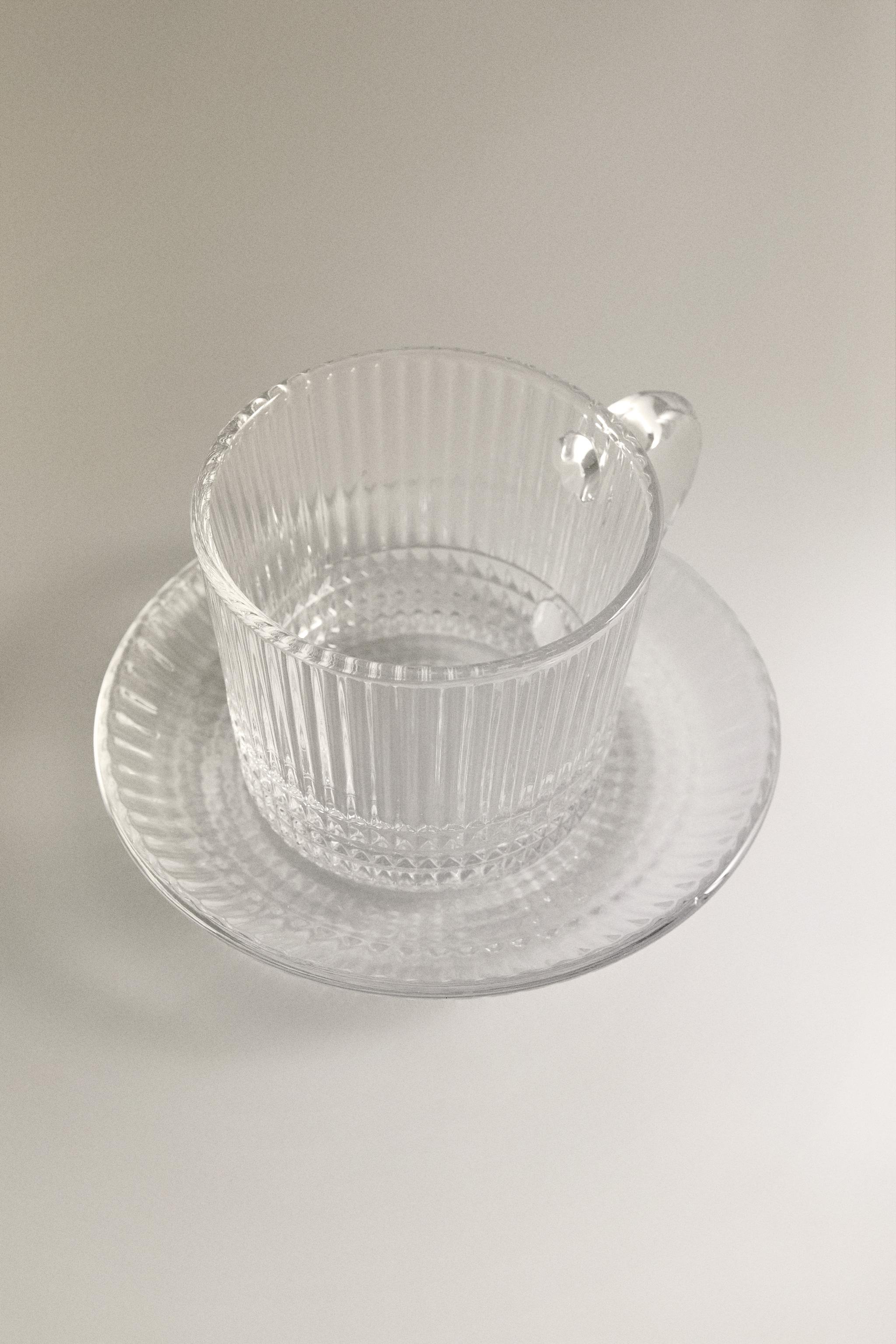 COFFEE CUP AND SAUCER WITH RAISED GEOMETRIC DESIGN