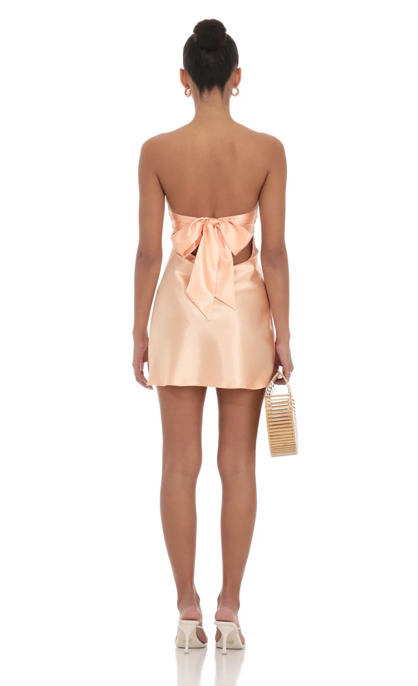 Satin Strapless Twist Cutout Dress in Peach - luluinthesky