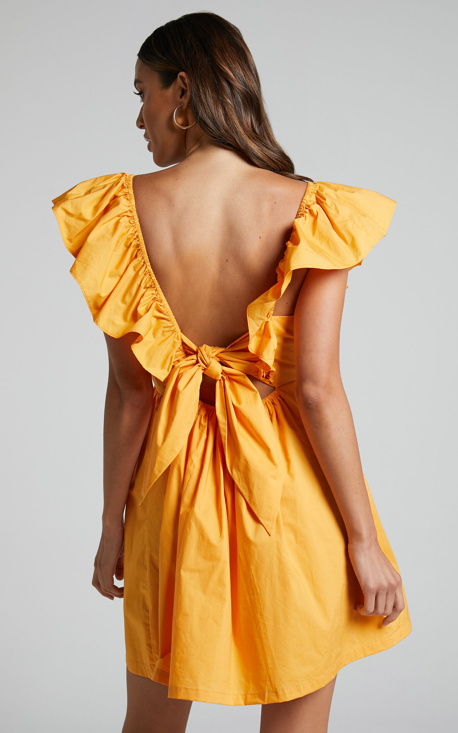 Raiza Mini Dress - Ruffle Sleeve Tie Back Plunge Dress in Marigold