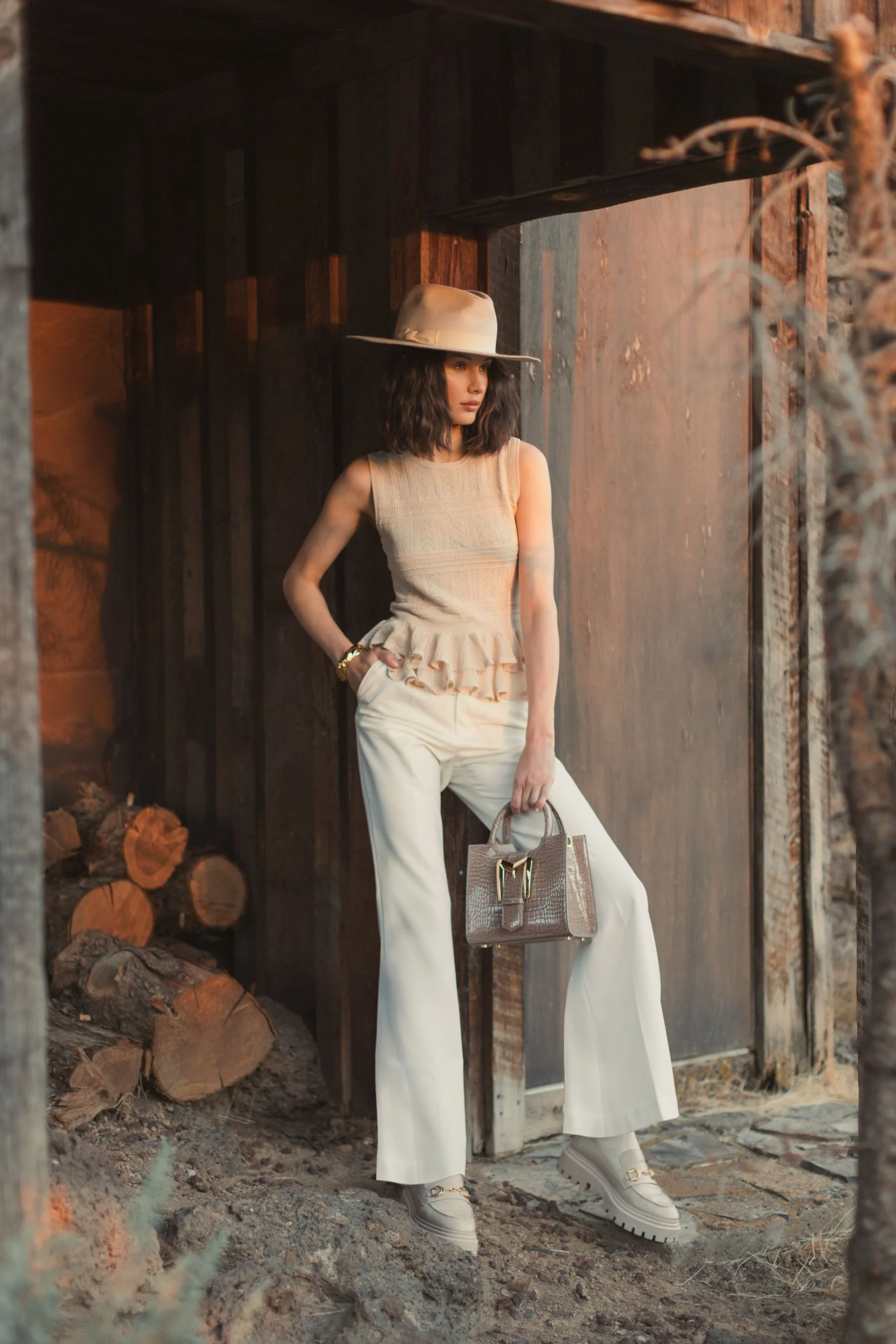 Sleeveless High Neck Knit Top With Ruffle Hem - FINAL SALE