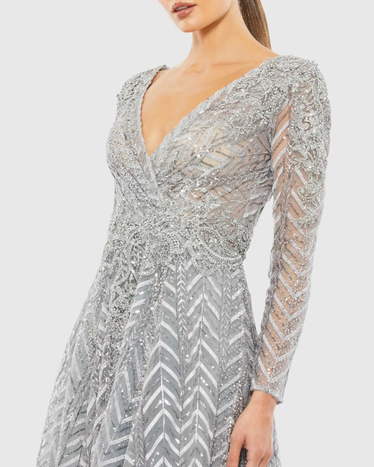 Silver Embellished Illusion Long Sleeve Wrap Over A Line Gown