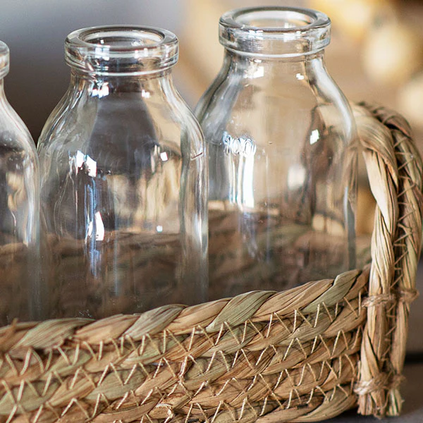 Wicker Basket with Four Milk Bottles