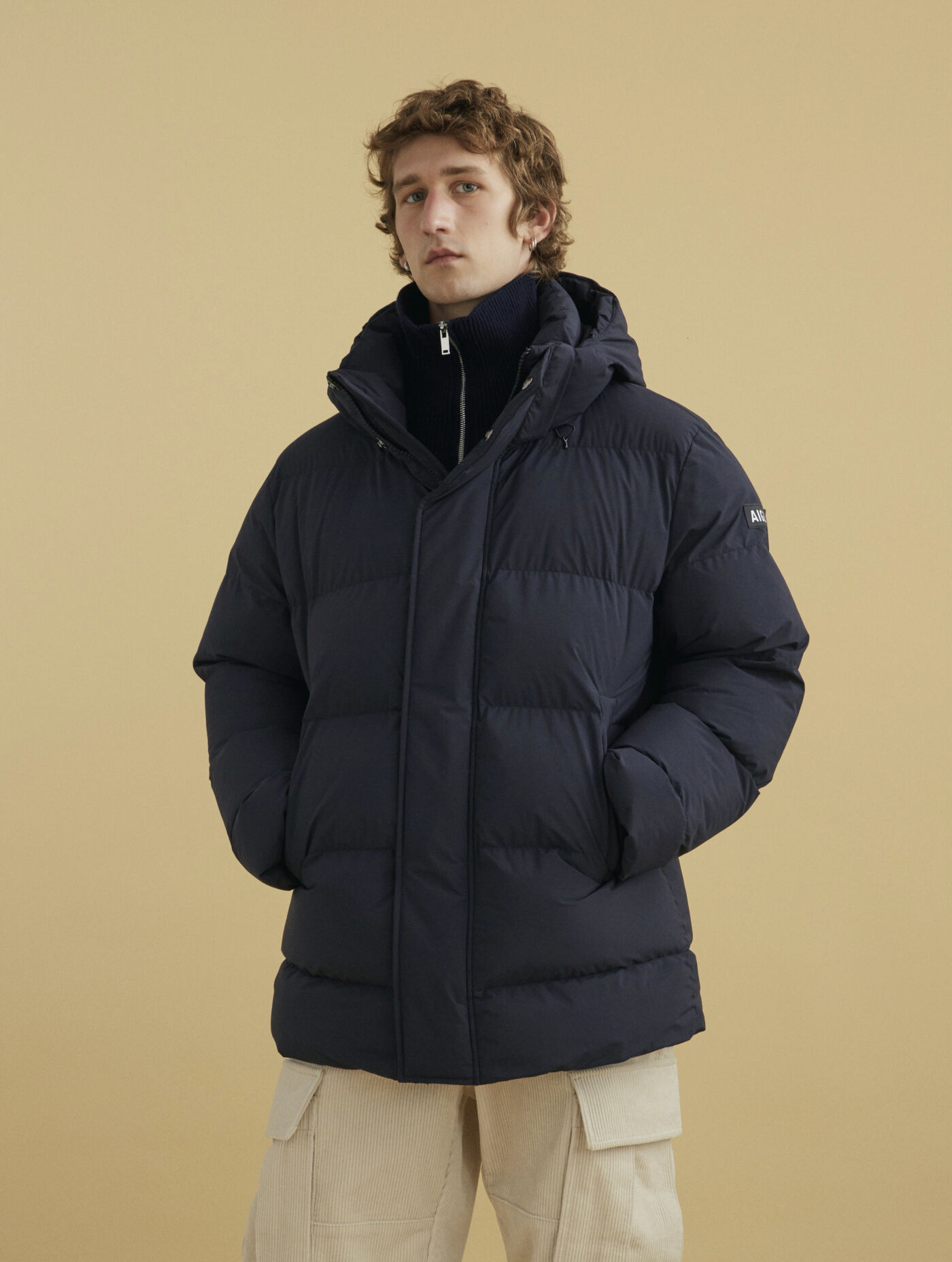 Mid-length hooded padded Dupont Sorona&reg; quilted waterproof jacket