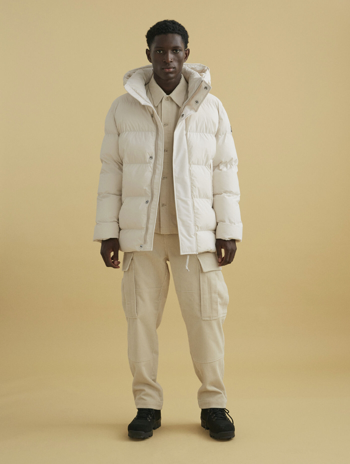 Mid-length hooded padded Dupont Sorona&reg; quilted waterproof jacket