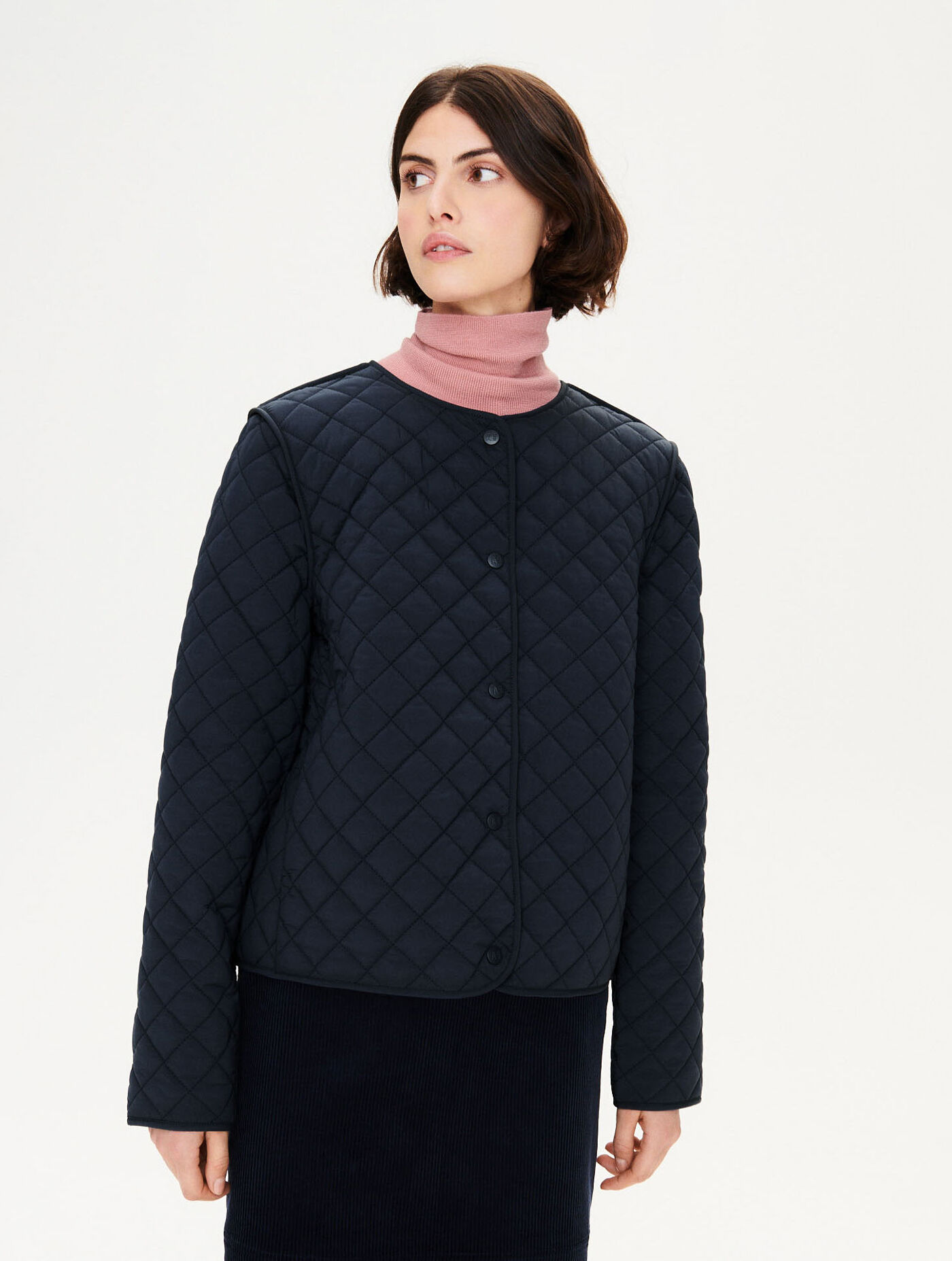 Short water-repellent quilted jacket attachable to TK parka