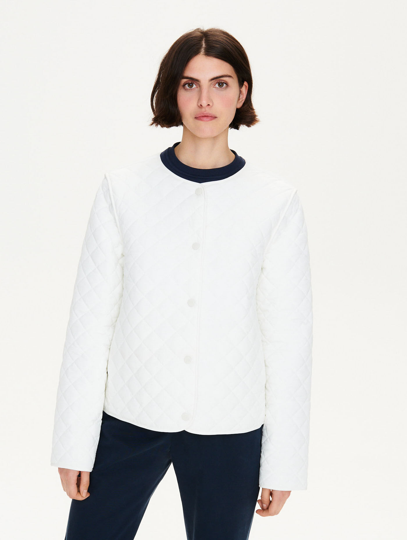 Short water-repellent quilted jacket attachable to TK parka