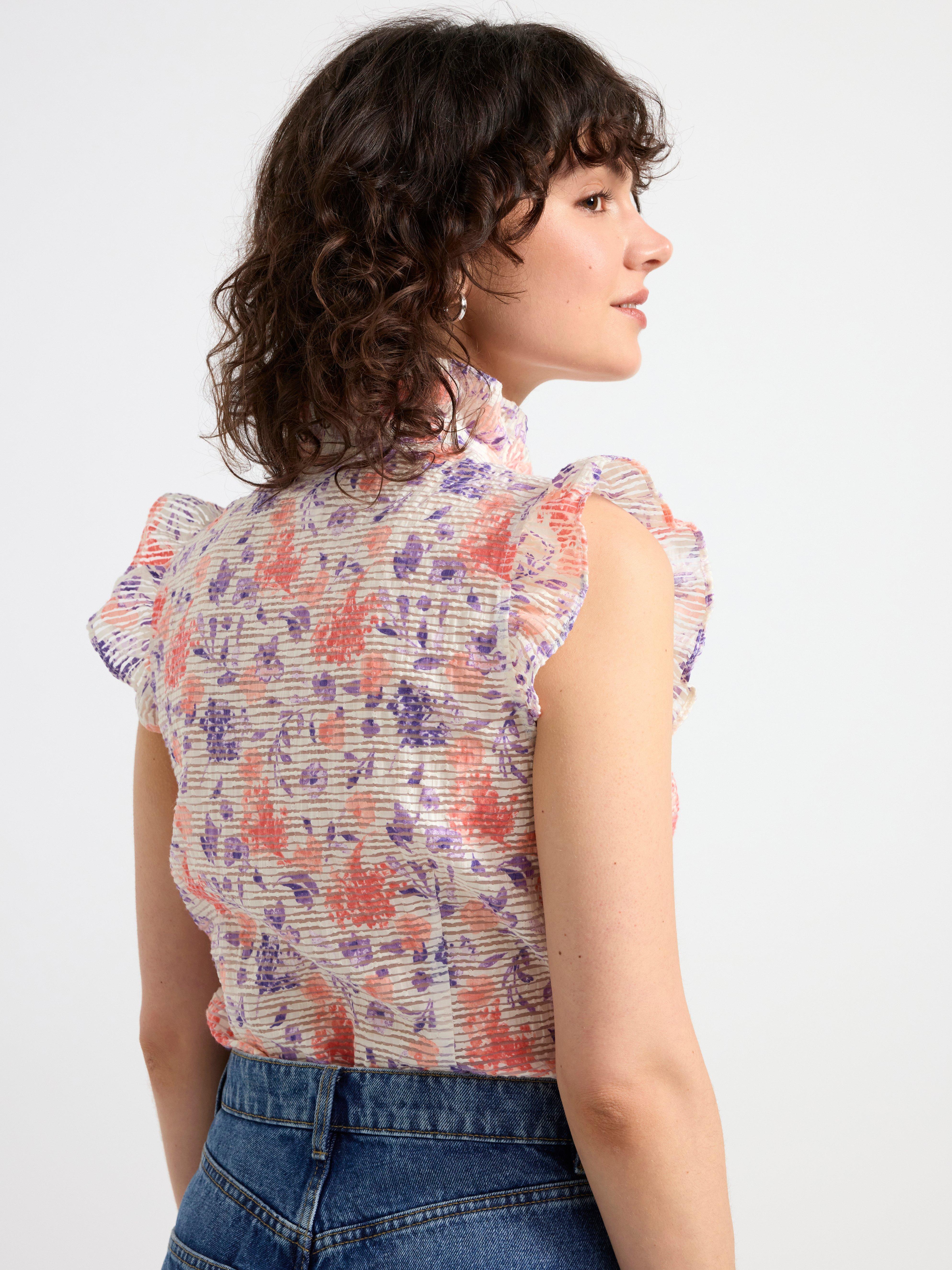 Sleeveless blouse with frills Coral
