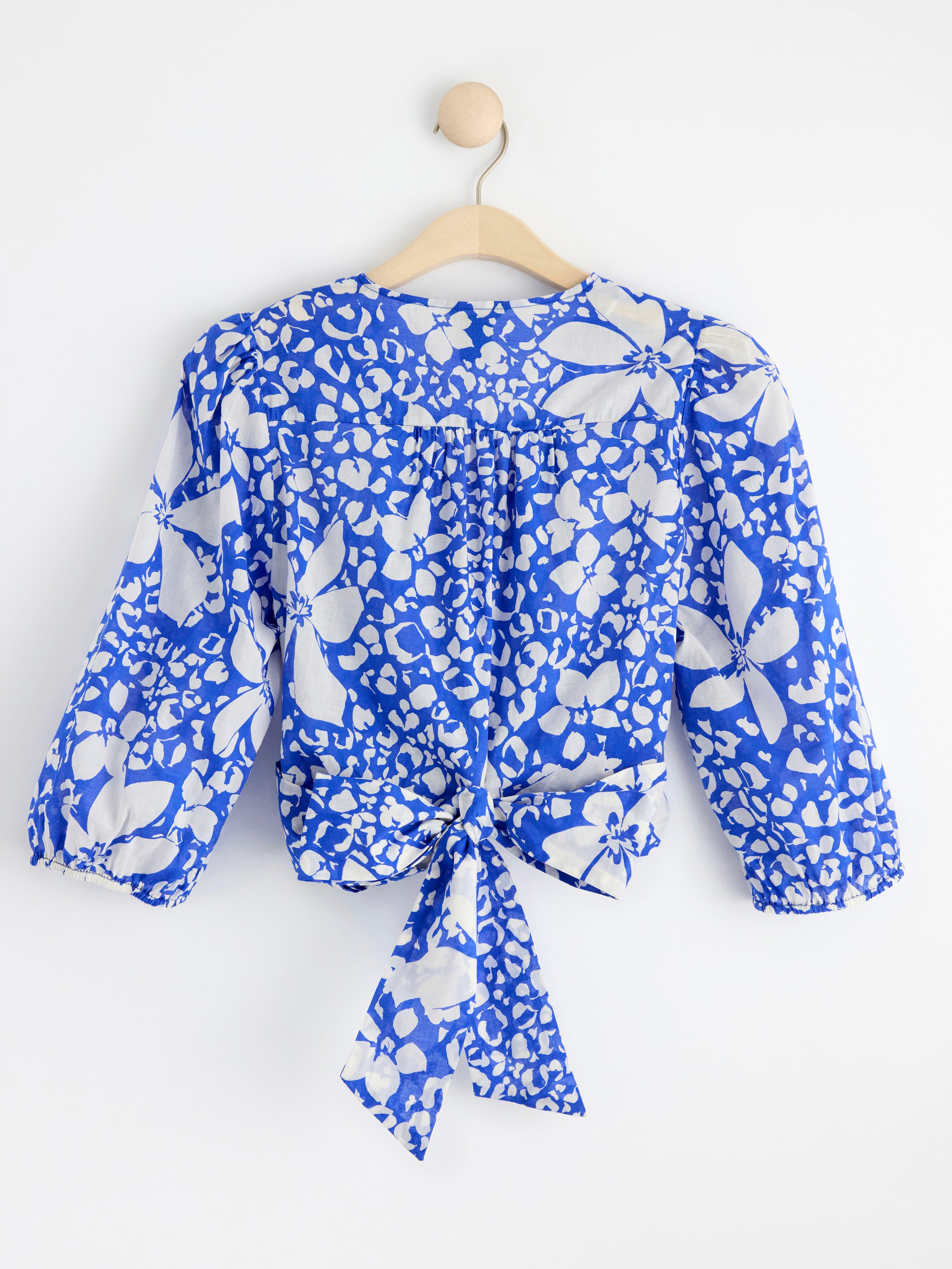 Patterned puff sleeve wrap blouse blue
