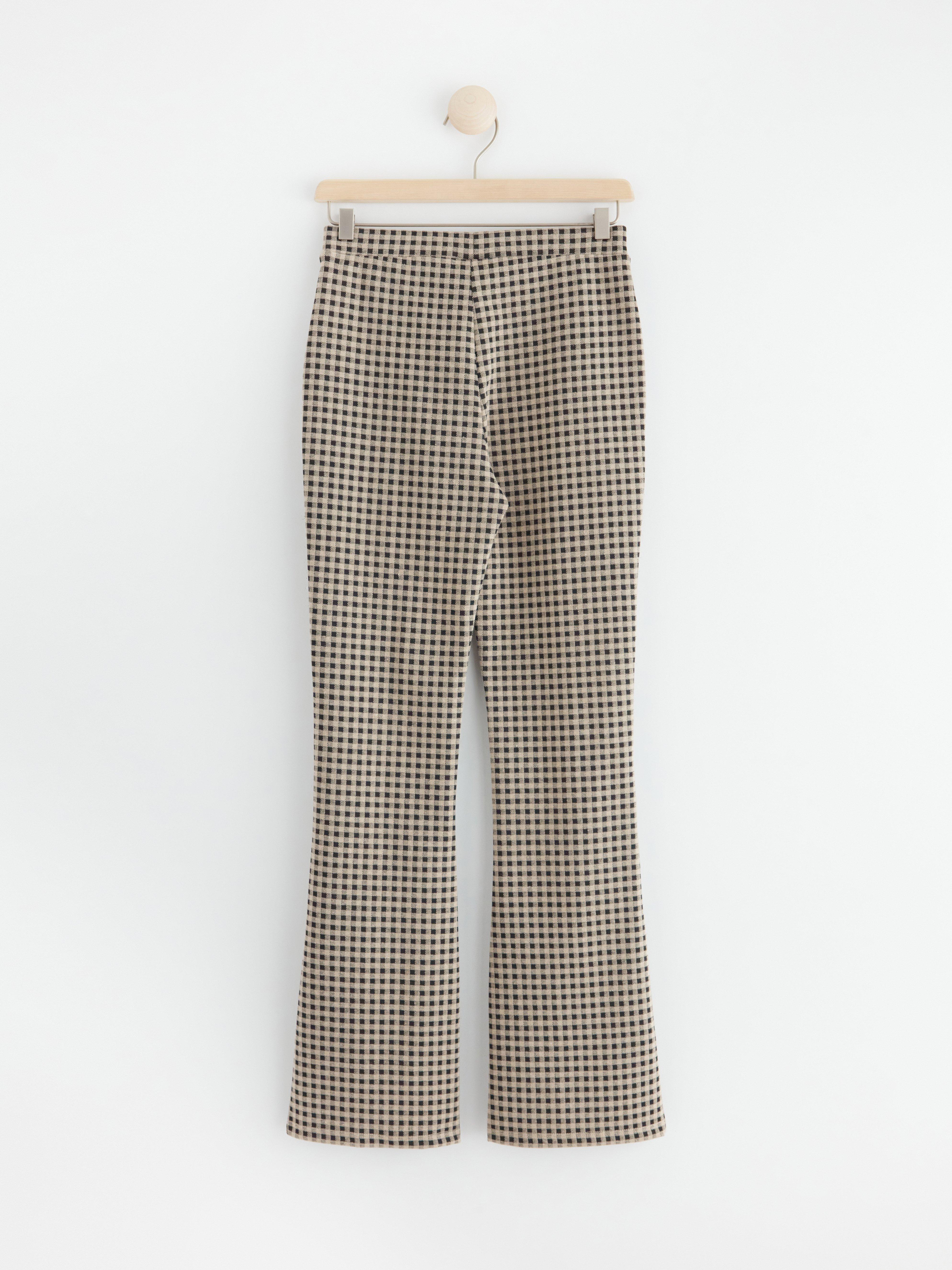 Flared trousers with checks Black