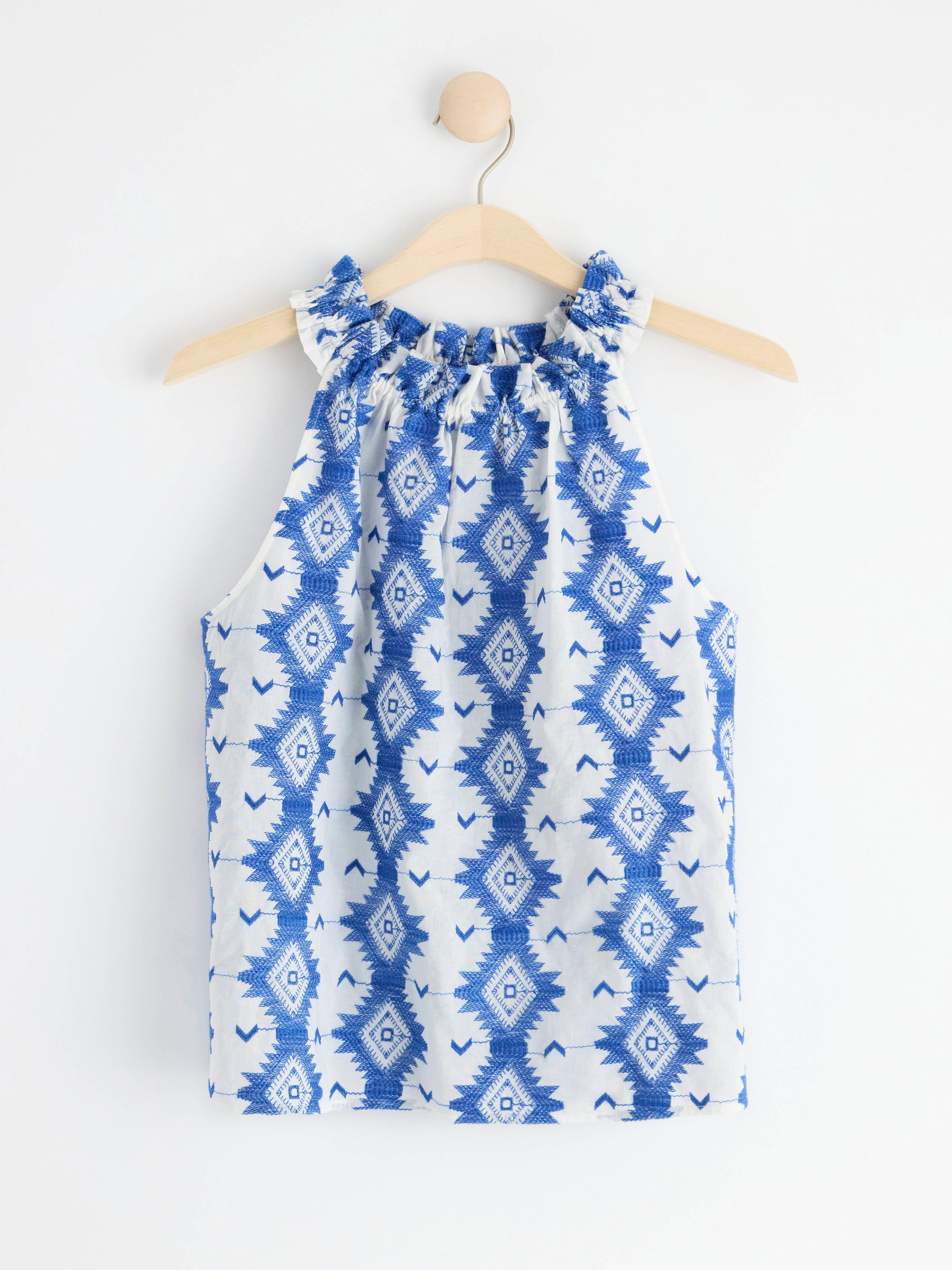 Sleeveless blouse with embroidery Off White