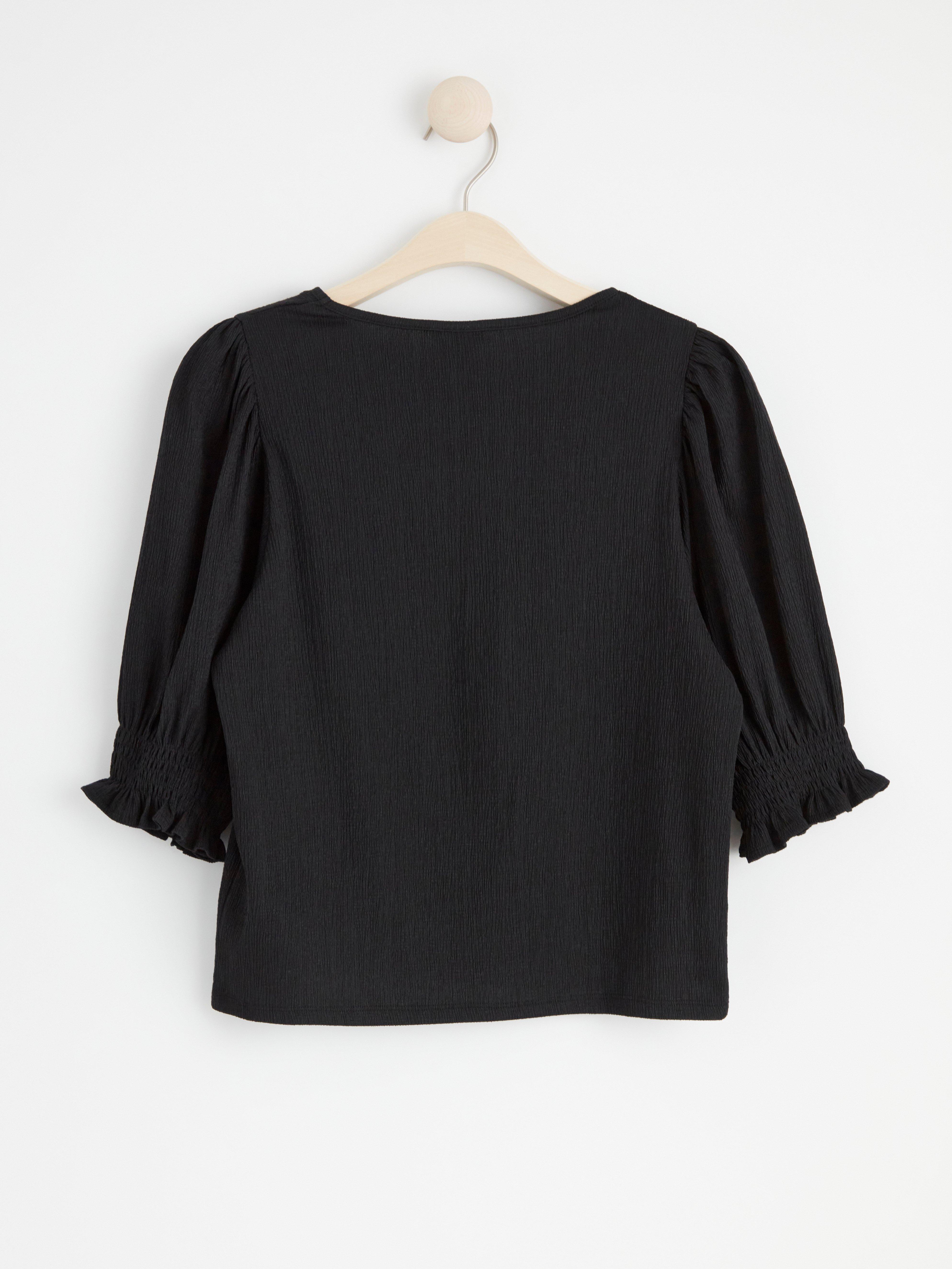 Textured puff sleeve top Black