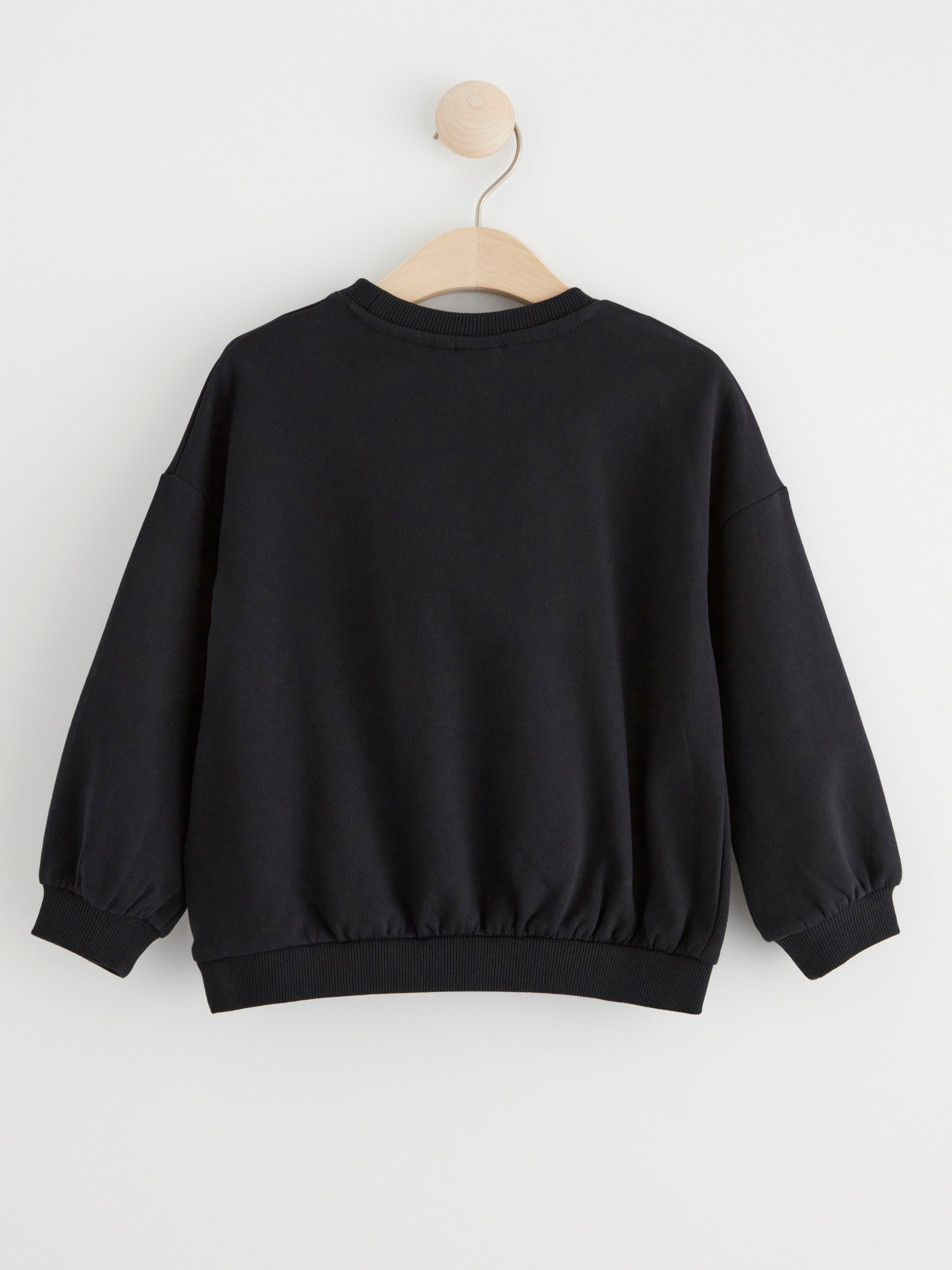 Sweatshirt with brushed inside and unicorn Black