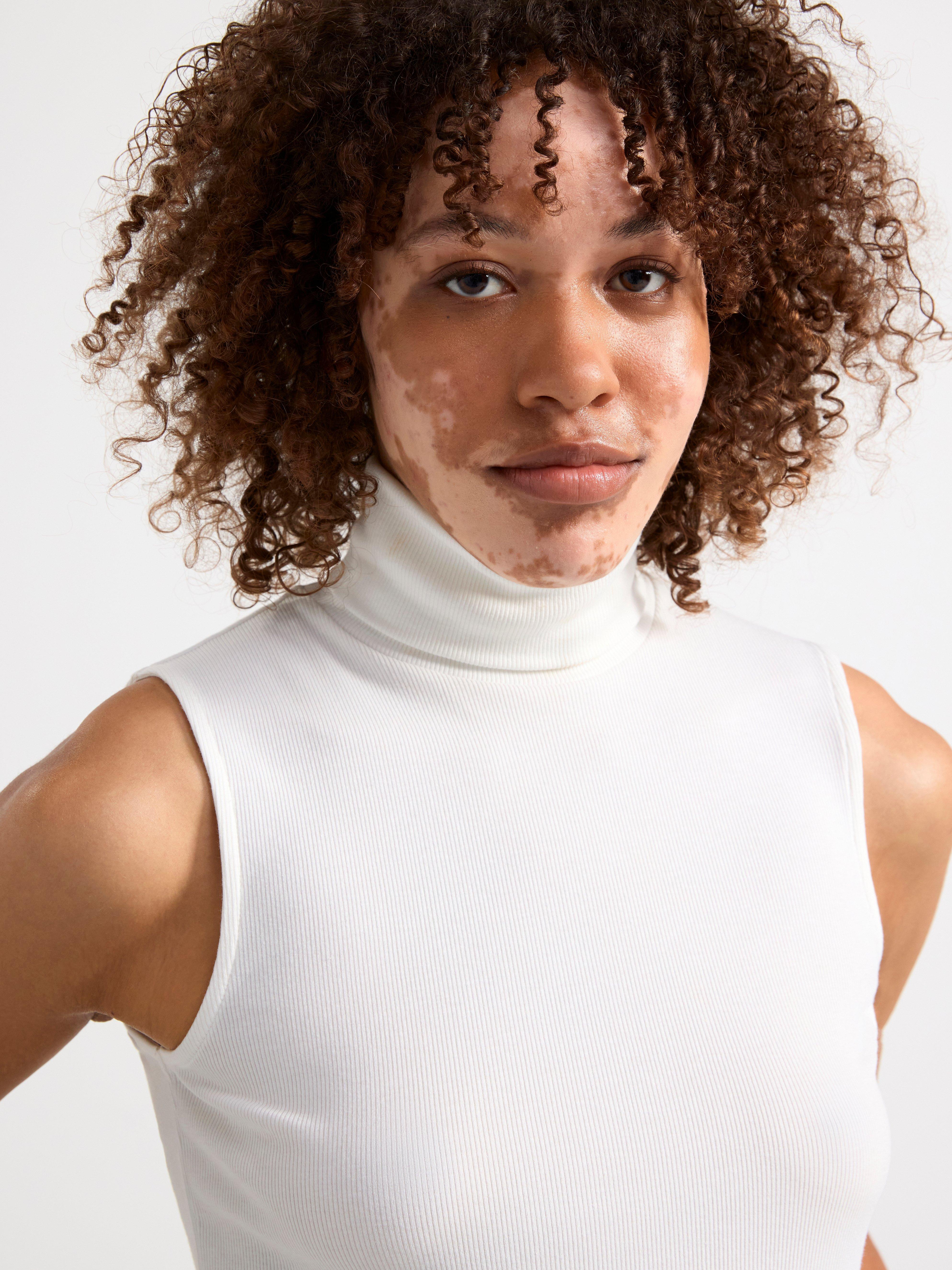 Sleeveless roll neck top Off White