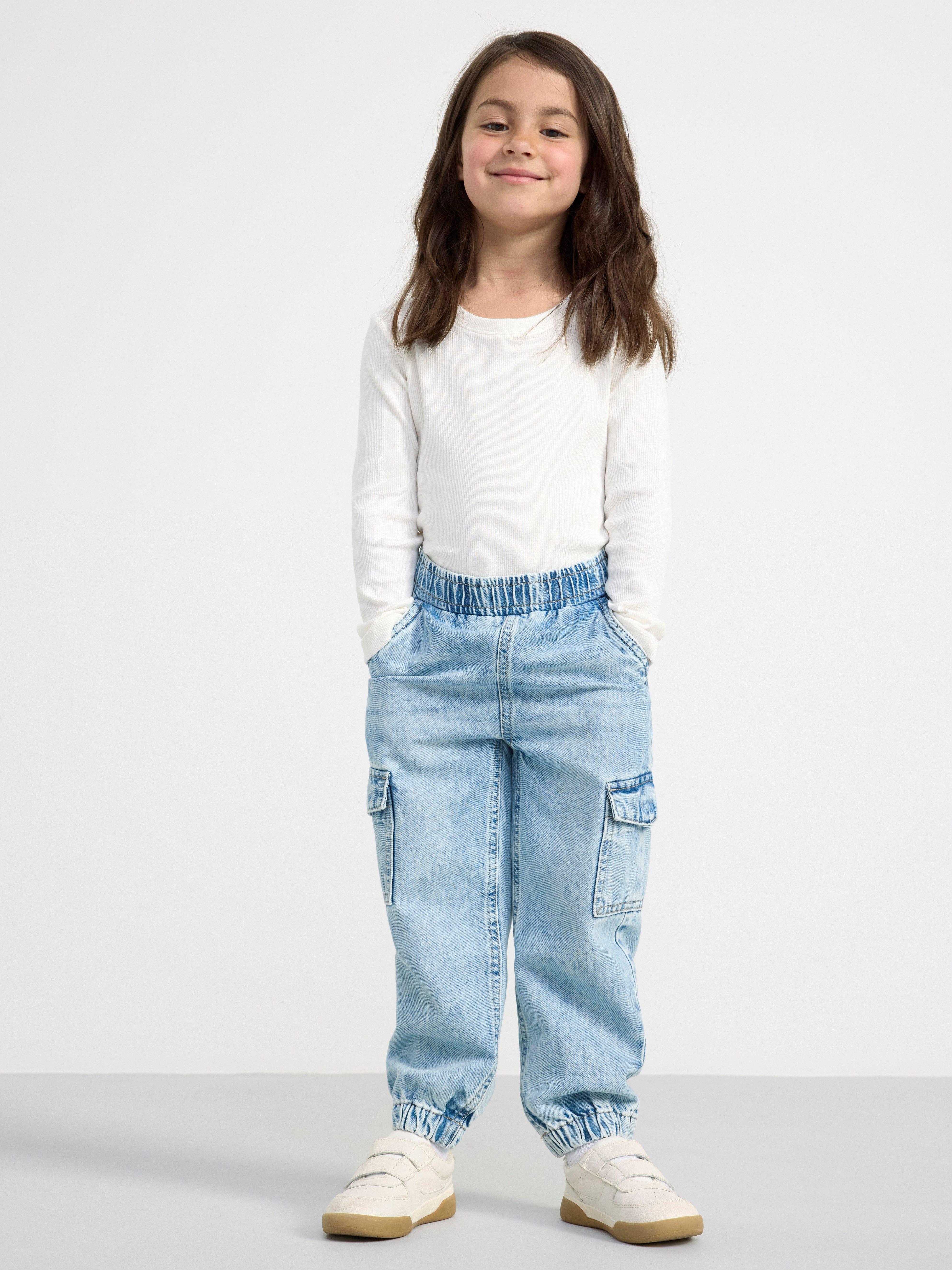 Trousers with cargo pockets Washed denim