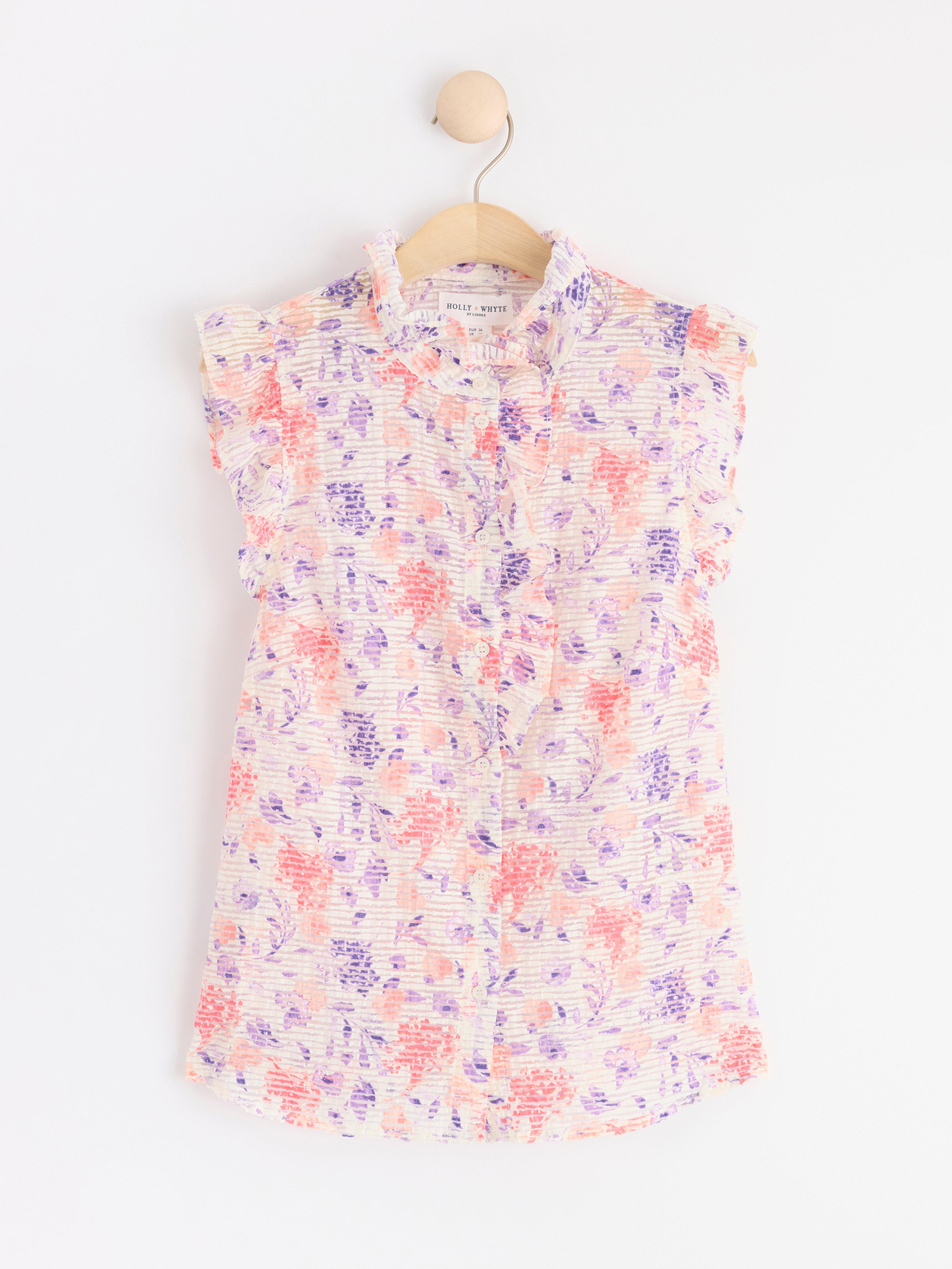Sleeveless blouse with frills Coral