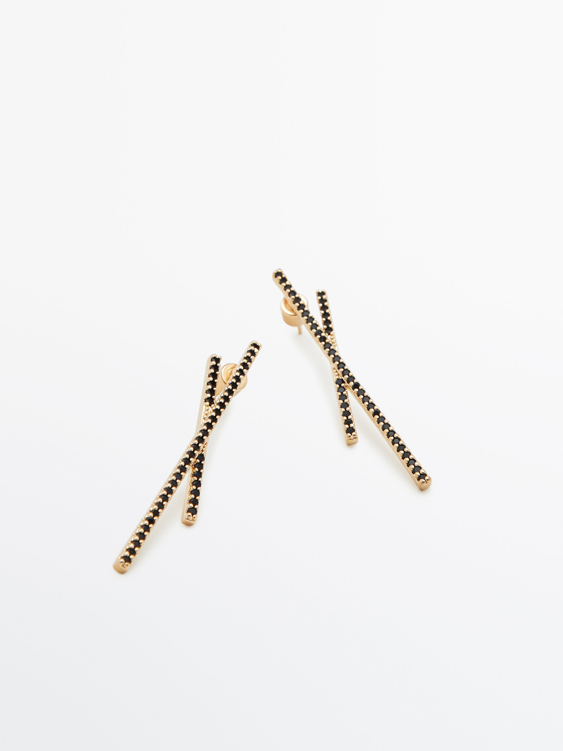 Pendientes asimétricos piedras negras baño oro - ORO