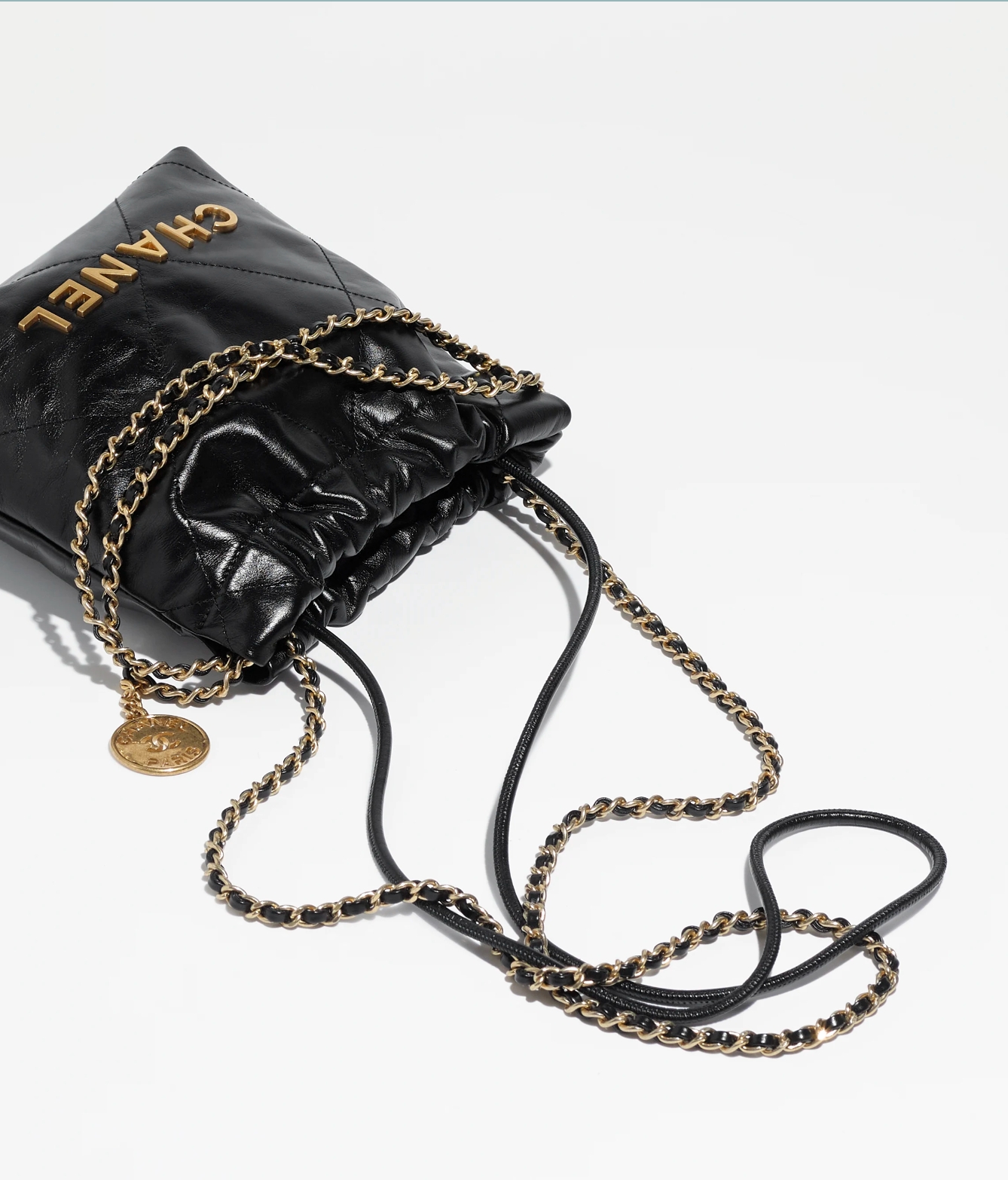 CHANEL 22 MINI HANDBAG Shiny Calfskin & Gold-Tone Metal Black