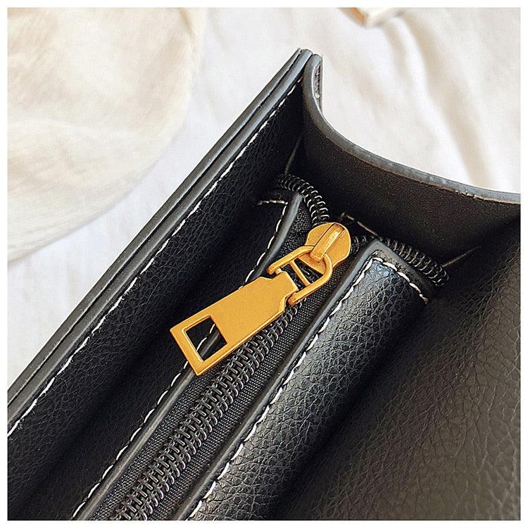 Ladies crossbody bag lion head metal detail