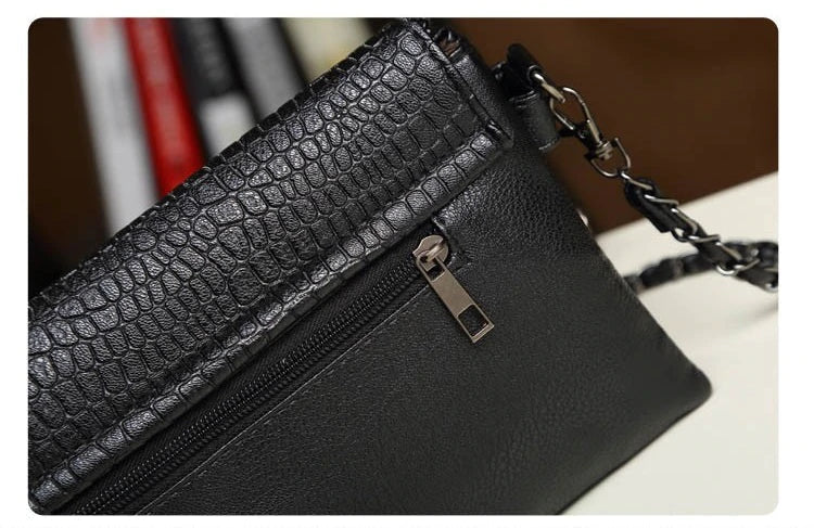 Stylish clutch and crossbody bag with chain detail available in sml & lrge