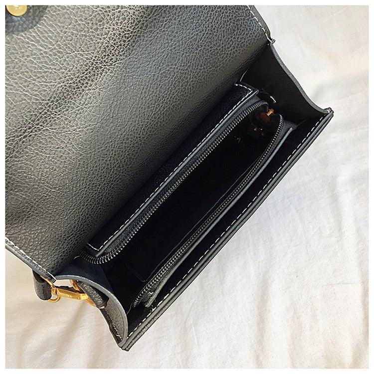 Ladies crossbody bag lion head metal detail