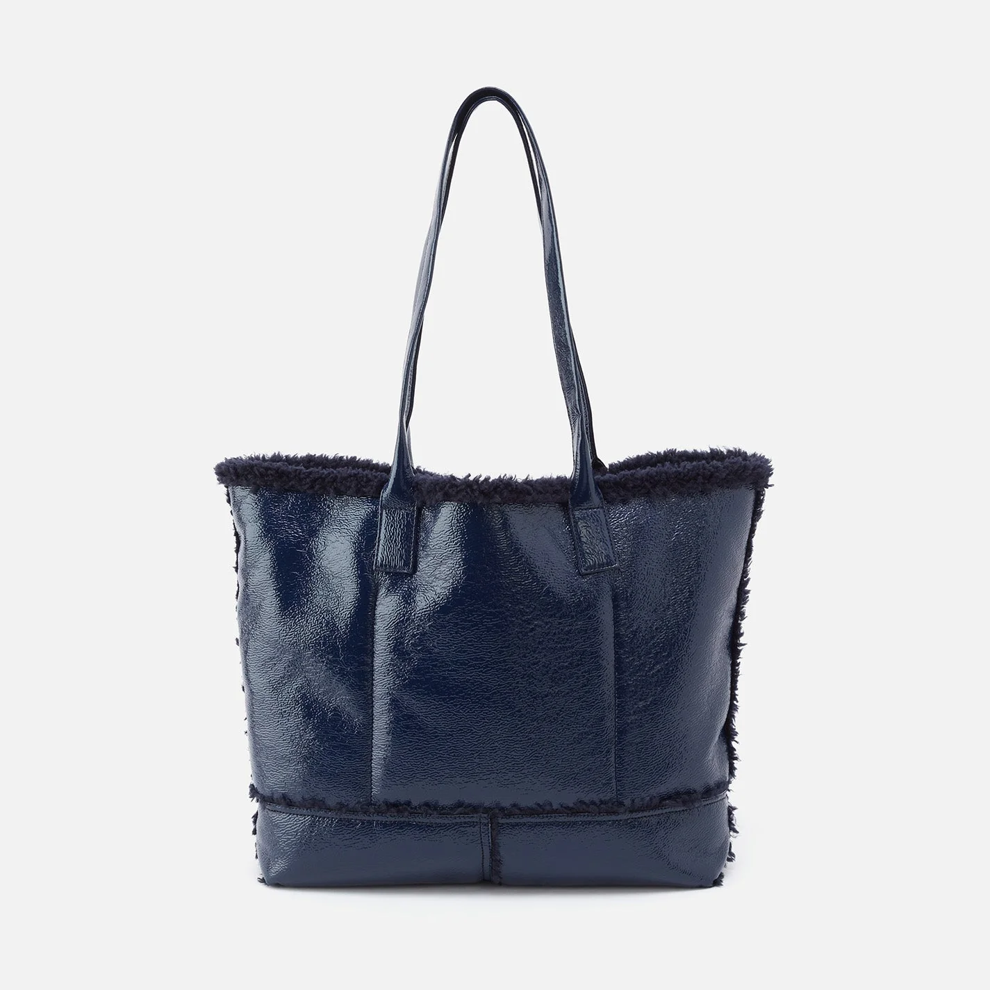 Hobo Shopper Tote in Pebbled Patent With Faux Shearling - Deep Indigo