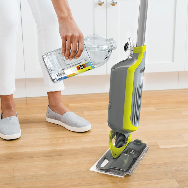 Shark  Cordless Wet/Dry Stick Vacuum. Features headlights and 2 disposable pads. 12-oz. of cleaner.