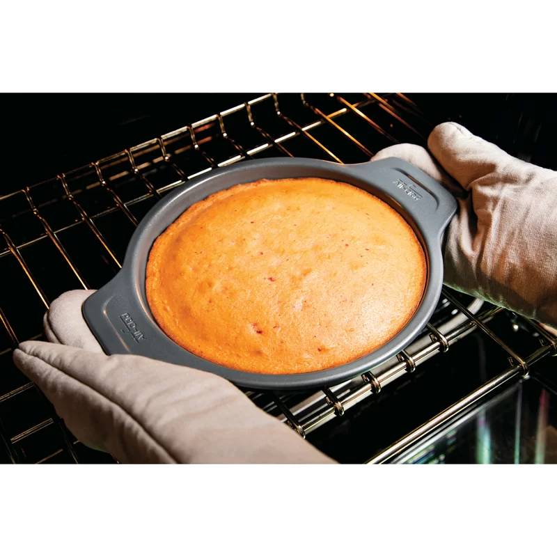 All-Clad J2575S64 Pro-Release Nonstick Bakeware Set including Half Sheet Pan. Cooling & Baking Rack. Round Cake Pan. Loaf Pan. 5 piece. Gray