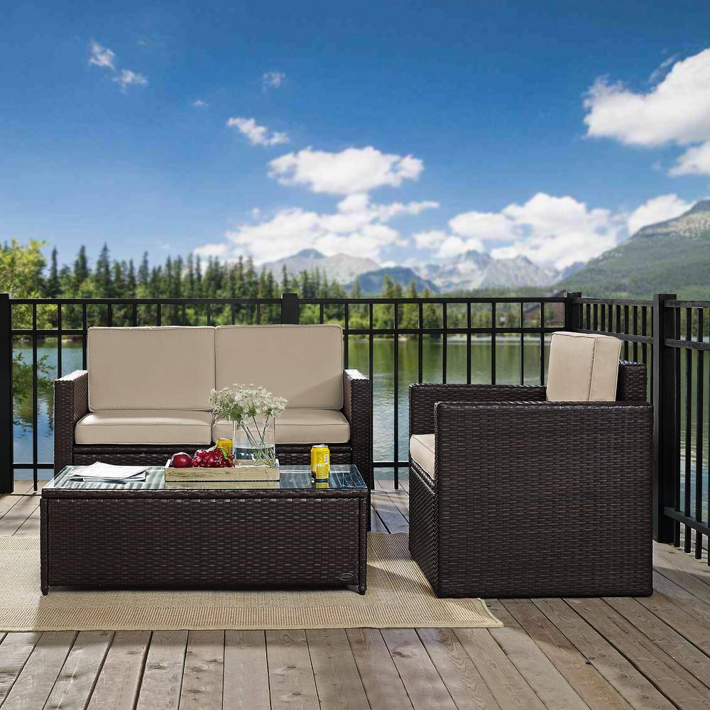 CROSLEY FURNITURE  Palm Harbor 3-Piece Wicker Outdoor Seating Set with Sand Cushions - Loveseat. Chair and Glass Top Table