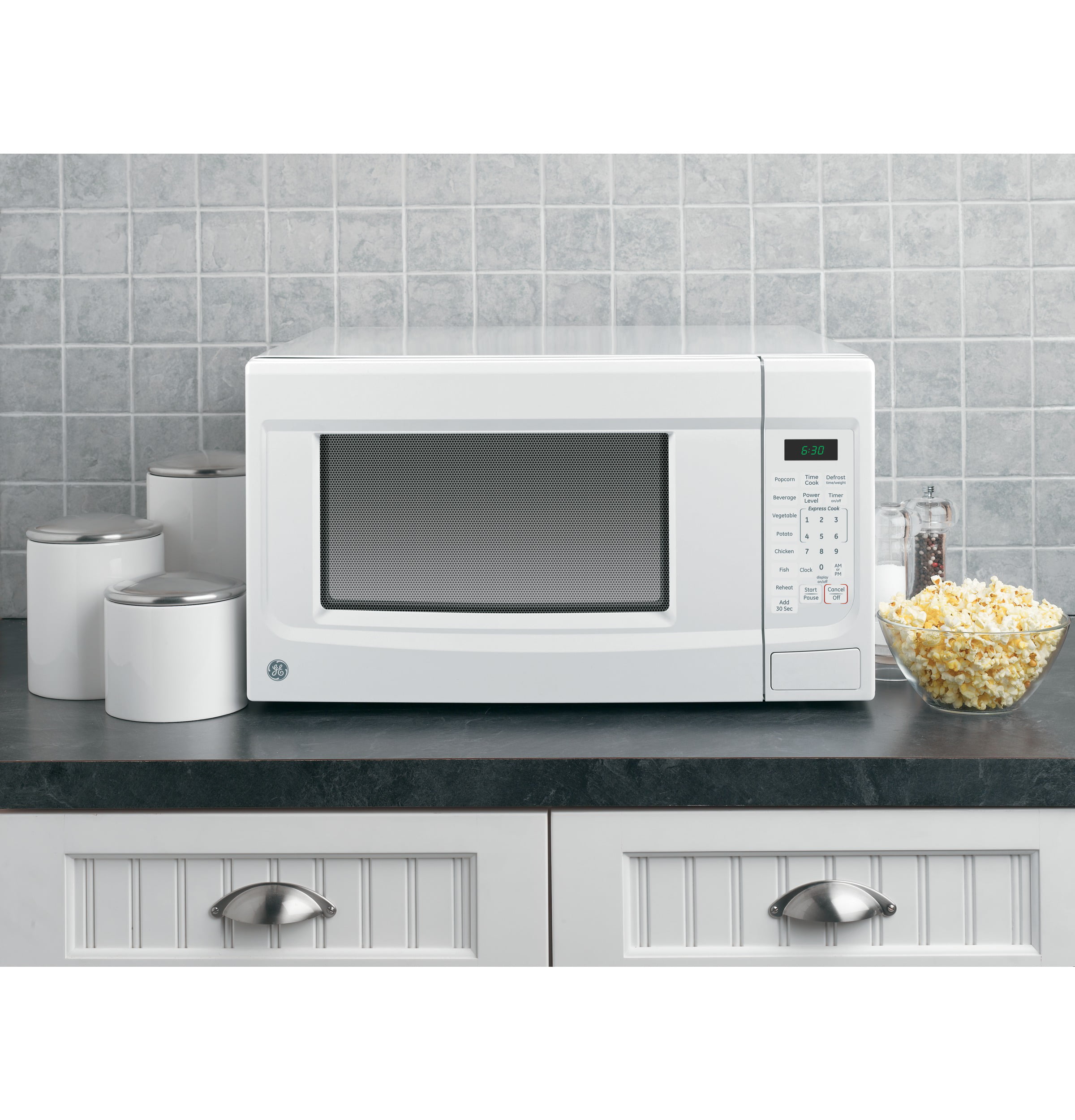 GE® 1.4 Cubic Foot Capacity Countertop Microwave Oven. White. JES1460DSWW
