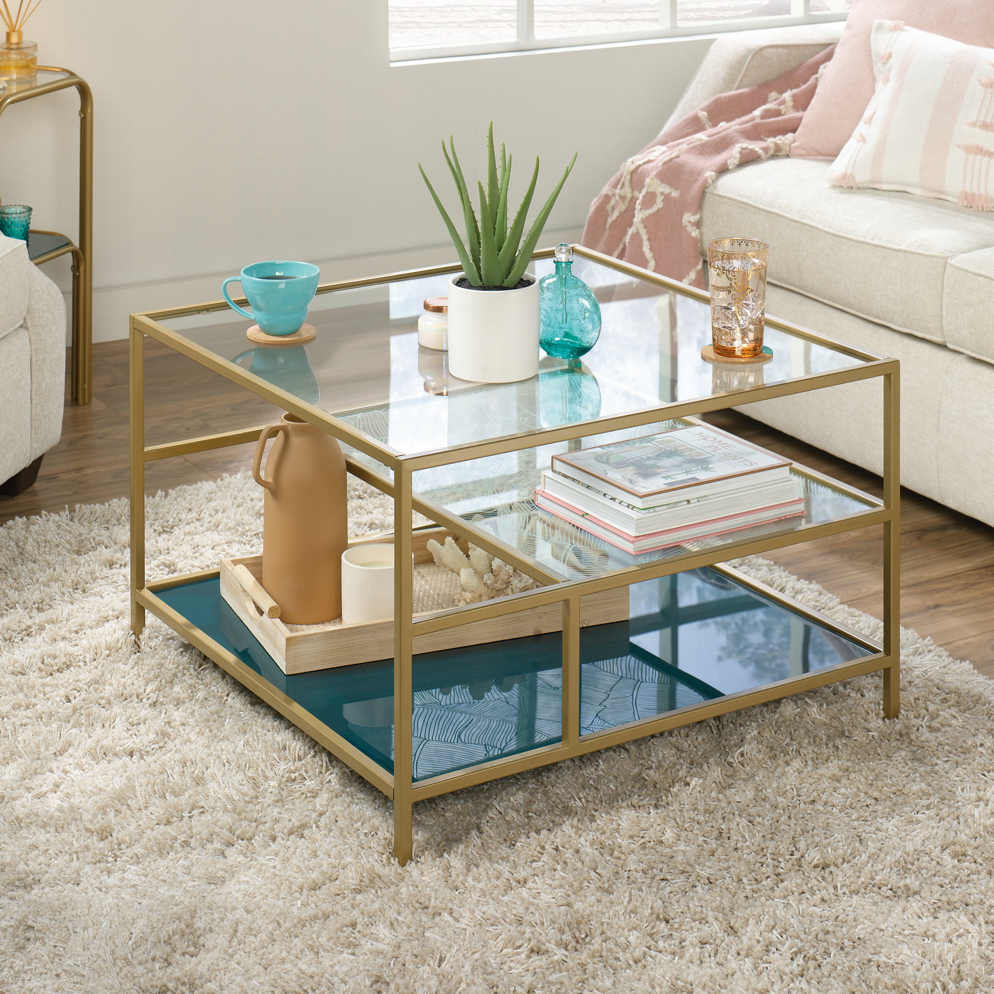 Sauder Coral Cape Square Glass Coffee Table with Shelves. Satin Gold/Clear