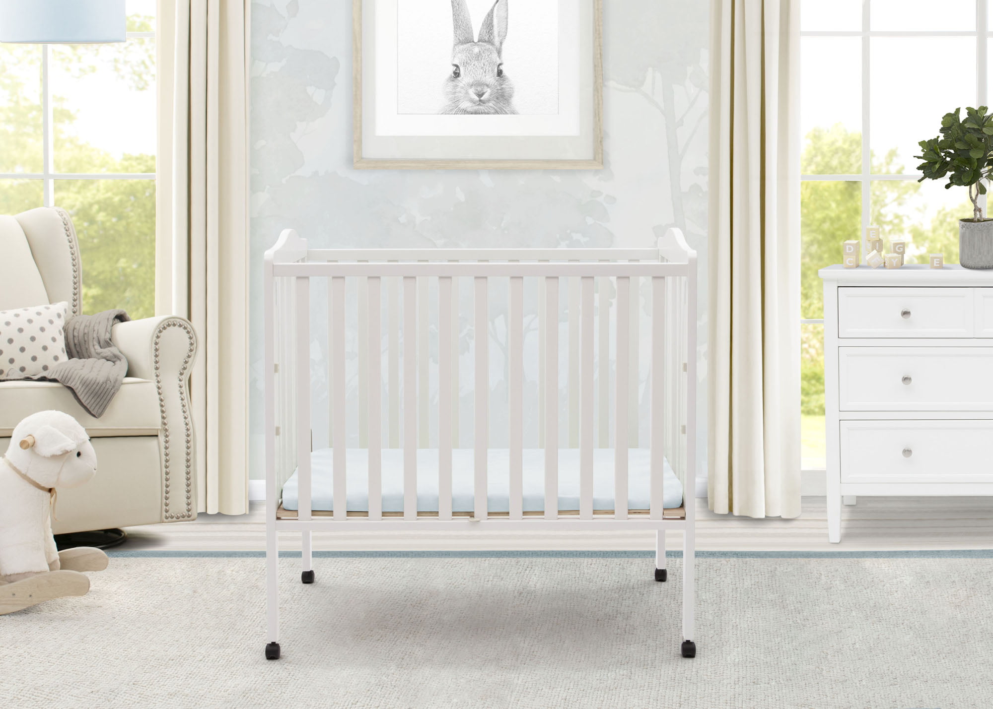 Delta Children Folding Portable Baby Mini Crib with 1.5-inch Mattress. White