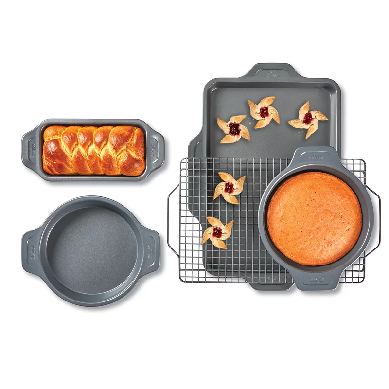 All-Clad J2575S64 Pro-Release Nonstick Bakeware Set including Half Sheet Pan. Cooling & Baking Rack. Round Cake Pan. Loaf Pan. 5 piece. Gray