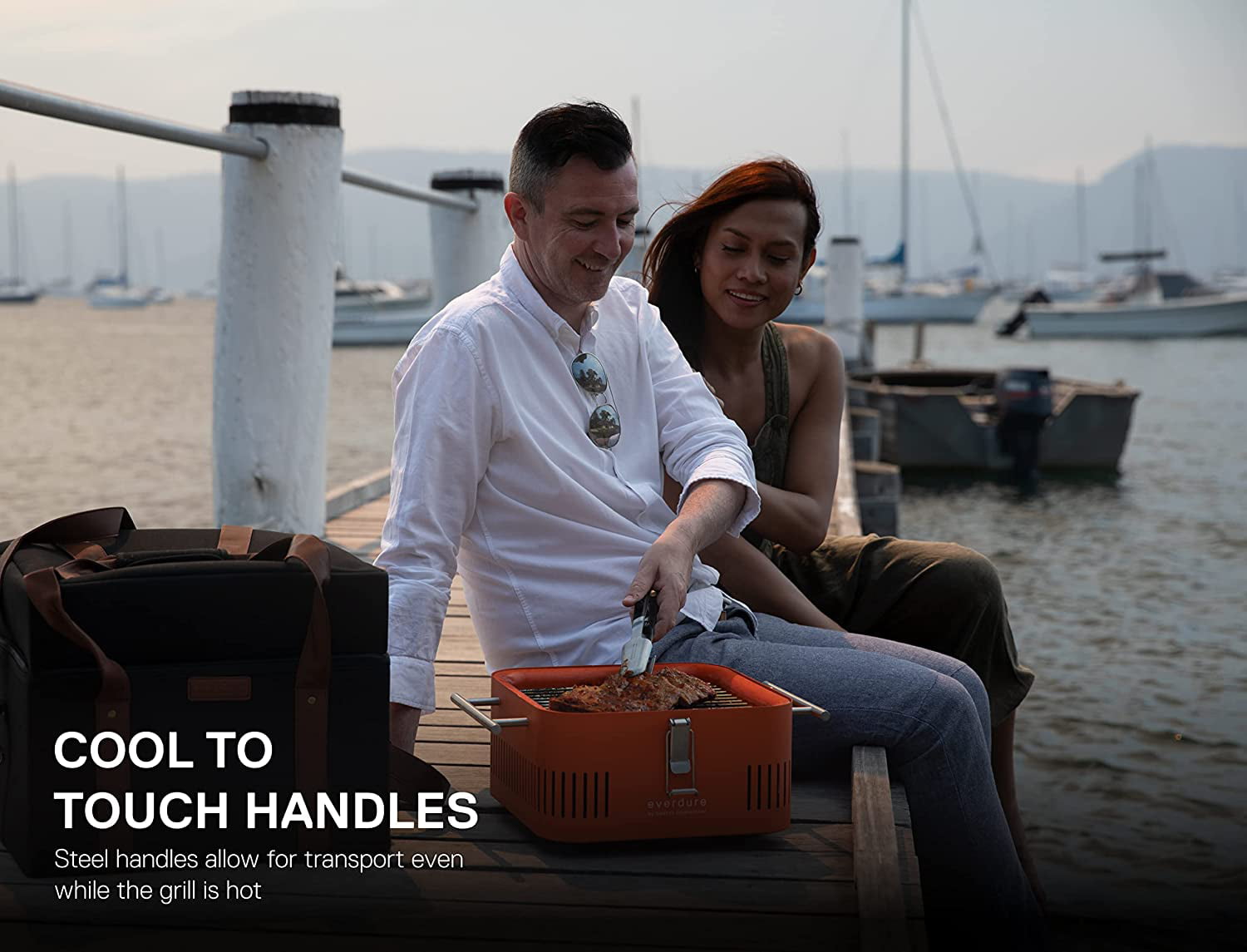 Everdure CUBE Charcoal Grill with Cool Touch Handles. Storage Container & Bamboo Serving Board