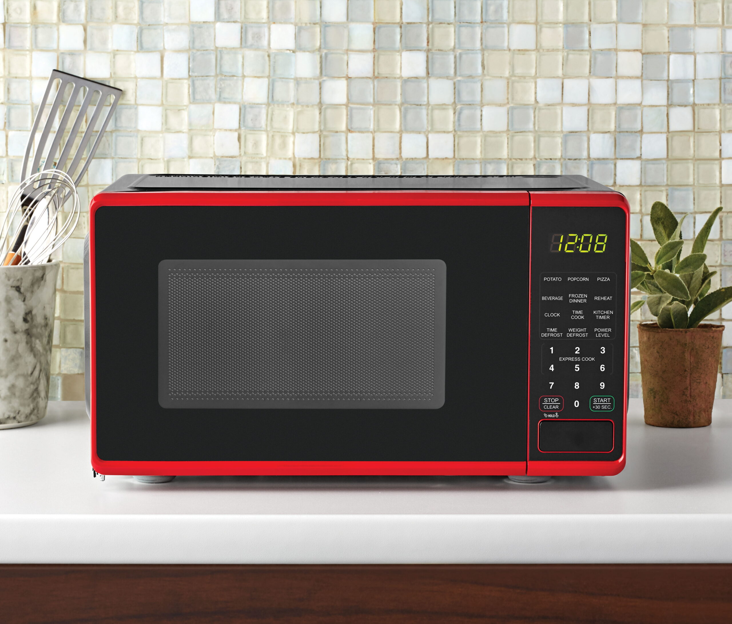 Mainstays 0.7 Cu ft Compact Countertop Microwave Oven. Red