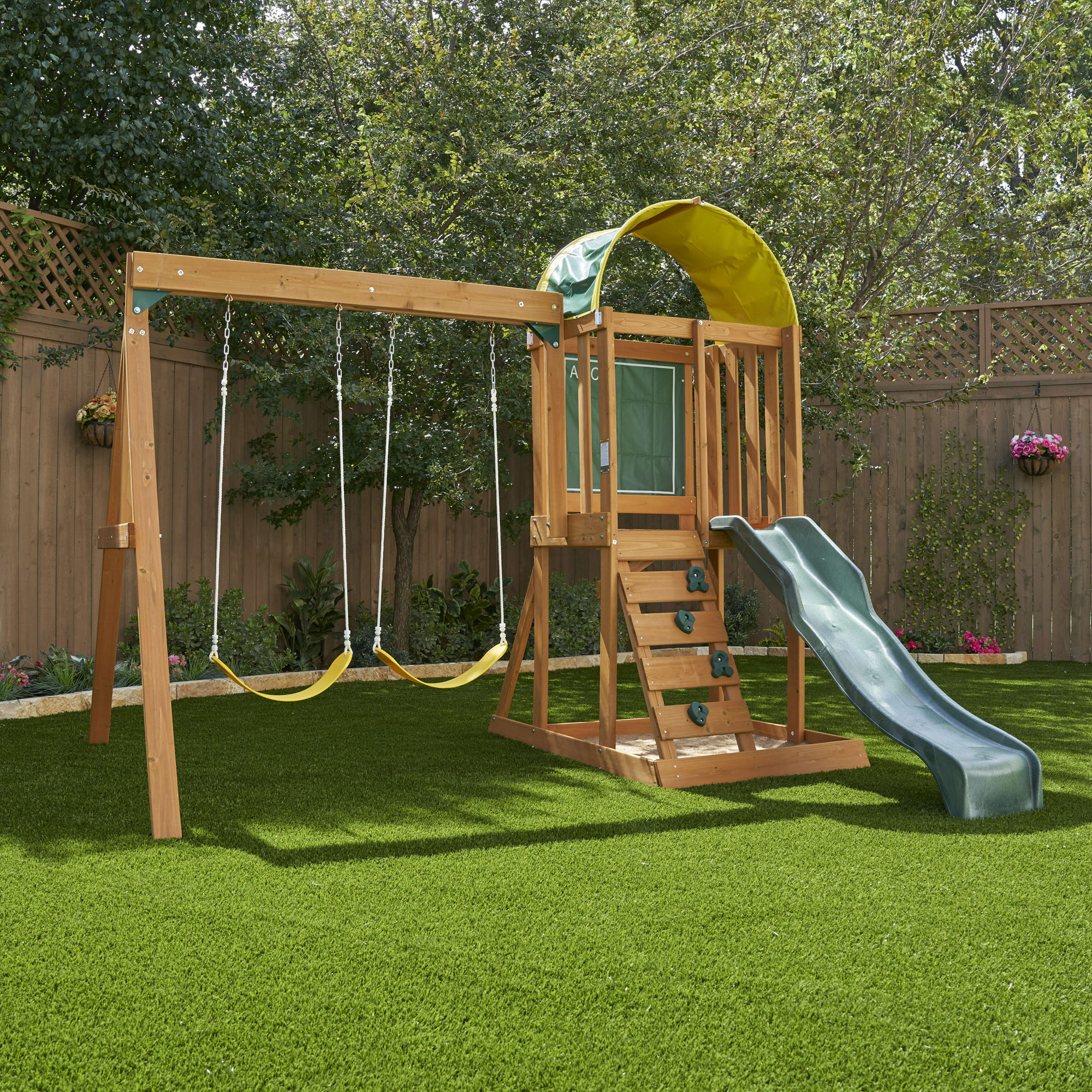 KidKraft Ainsley Wooden Outdoor Swing Set with Slide. Chalk Wall. Canopy and Rock Wall