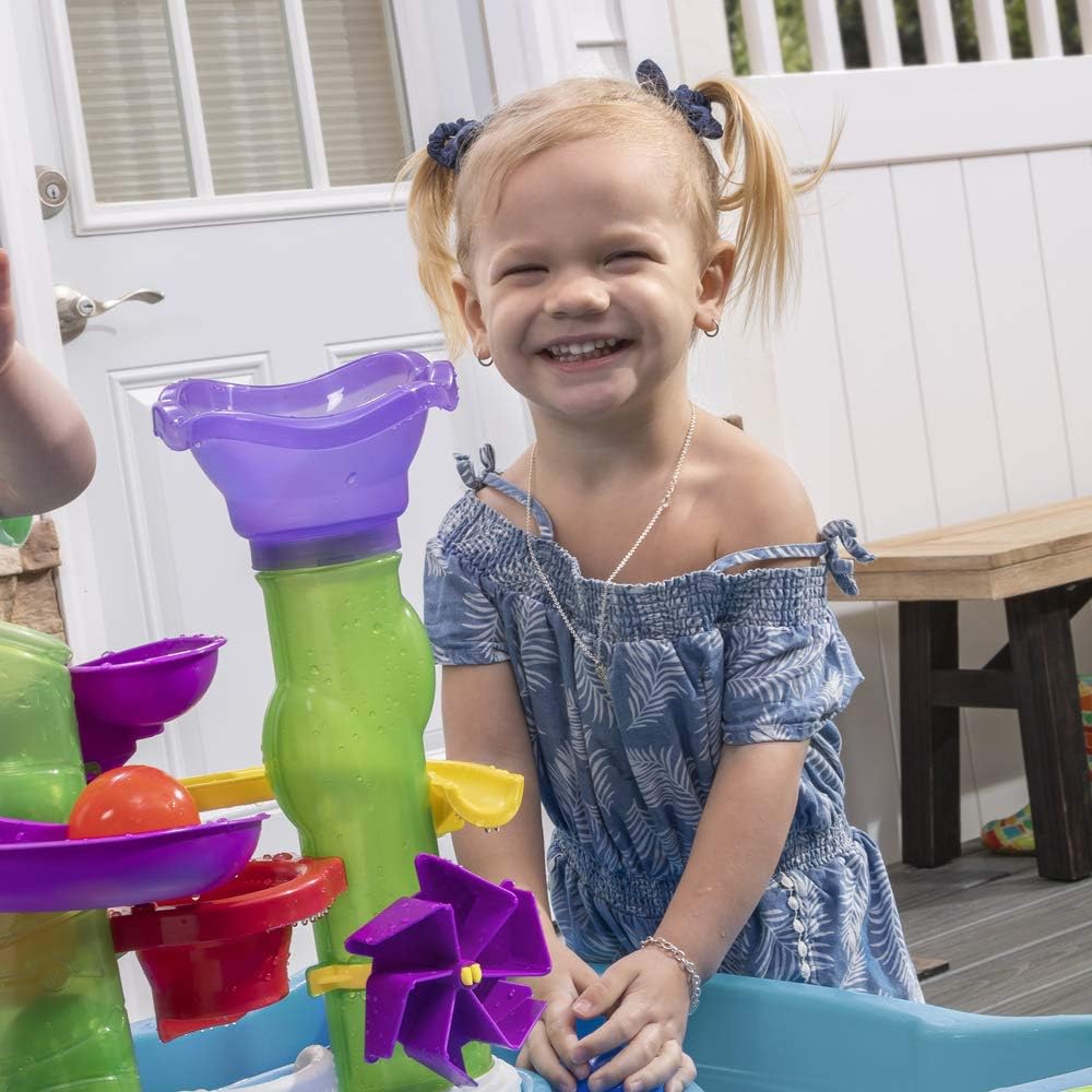 Step2 Lazy Maze River Run Water Table. Includes 6 balls. 2 flippers and 2 pouring cups. Blue and Orange