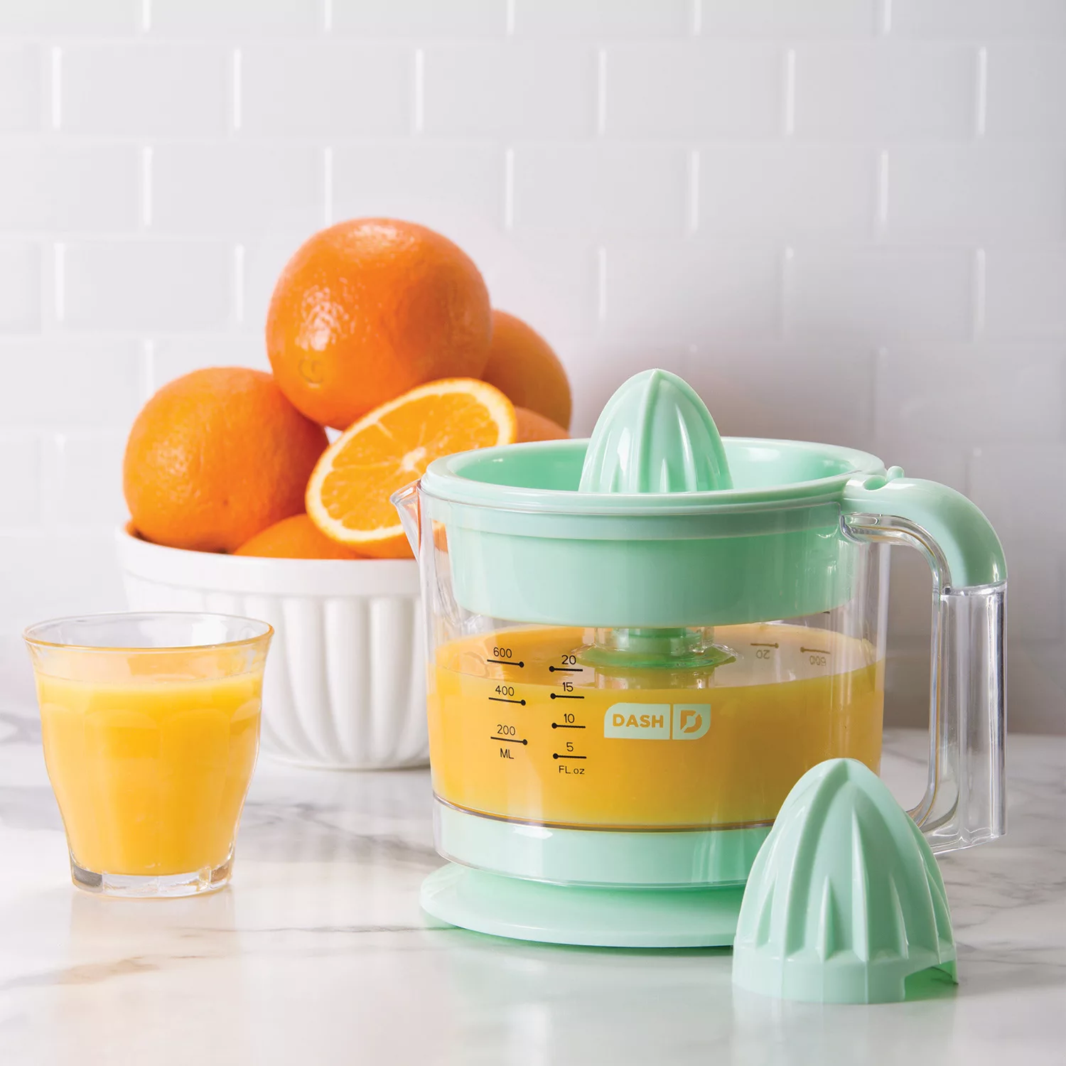 Dash Citrus Juicer Extractor: Compact Juicer for Healthy Juice. Oranges. Lemons. Limes. Grapefruit & other Citrus Fruit with Easy Pour Spout + 32 oz Pitcher - Aqua