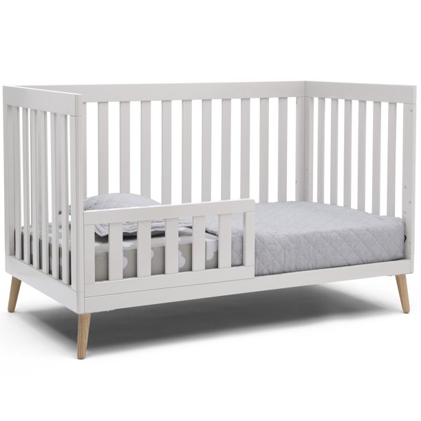 Delta Children Essex 4-in-1 Convertible Baby Crib. Bianca White/Natural Legs