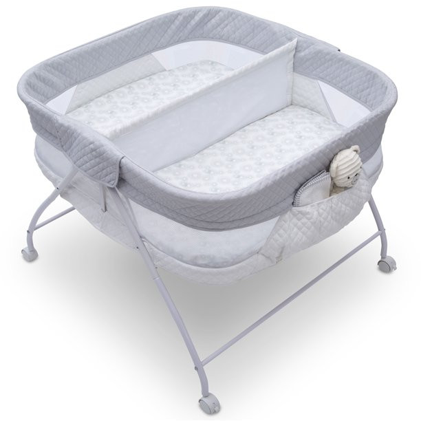 Delta Children Little Folks Twin EZ Fold Ultra Compact Double Bassinet. Aqua Geo