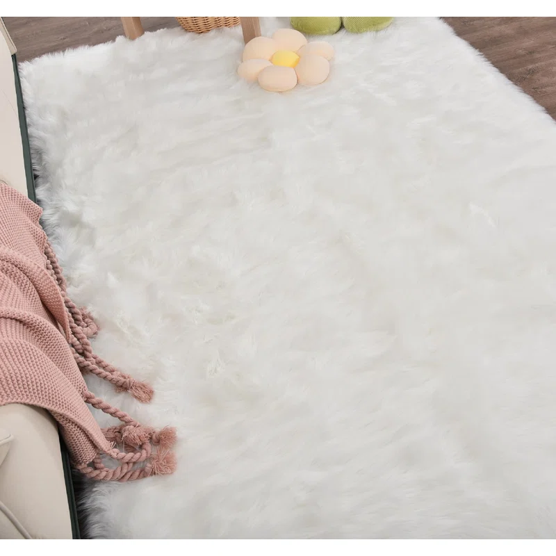 Everly Quinn Mamduh Handmade Shag Faux Sheepskin White Rug. Rectangle 14' x 10'