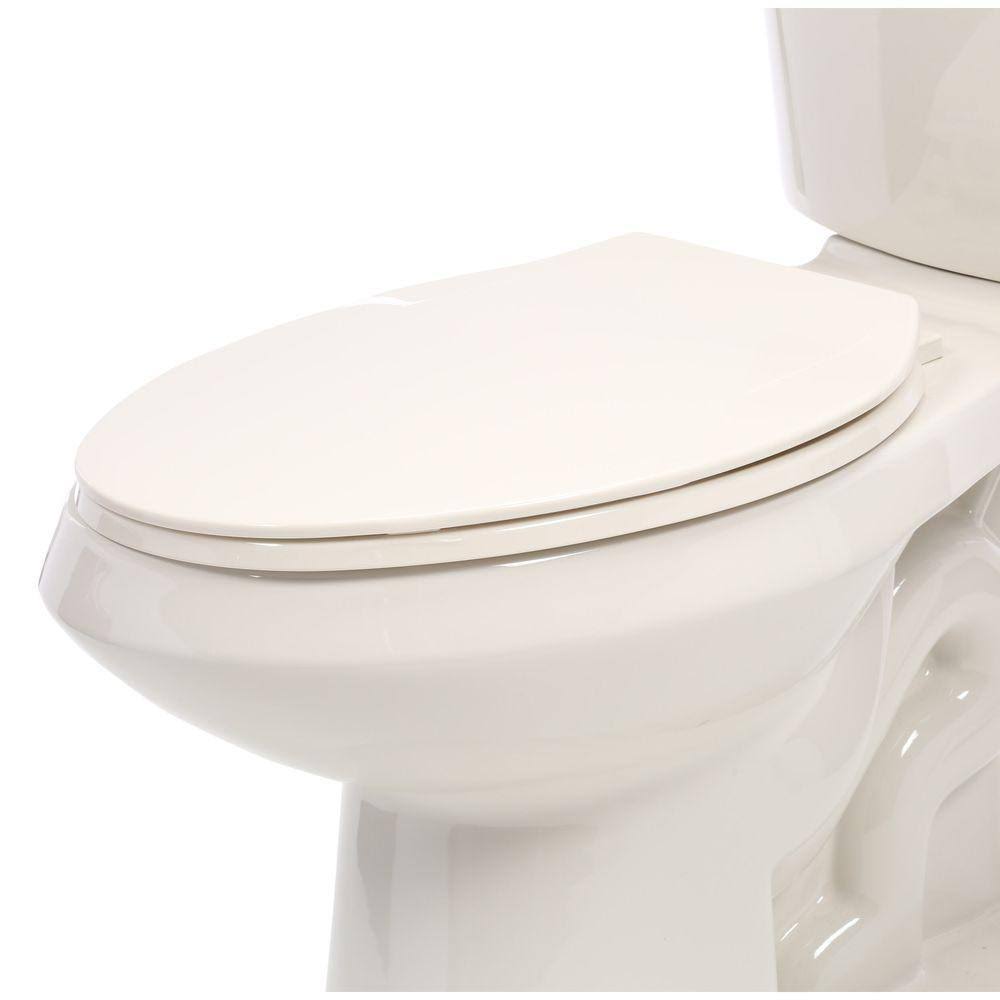 Glacier Bay 2-Piece 1.1 GPF/1.6 GPF High Efficiency Dual Flush Elongated Toilet in Biscuit