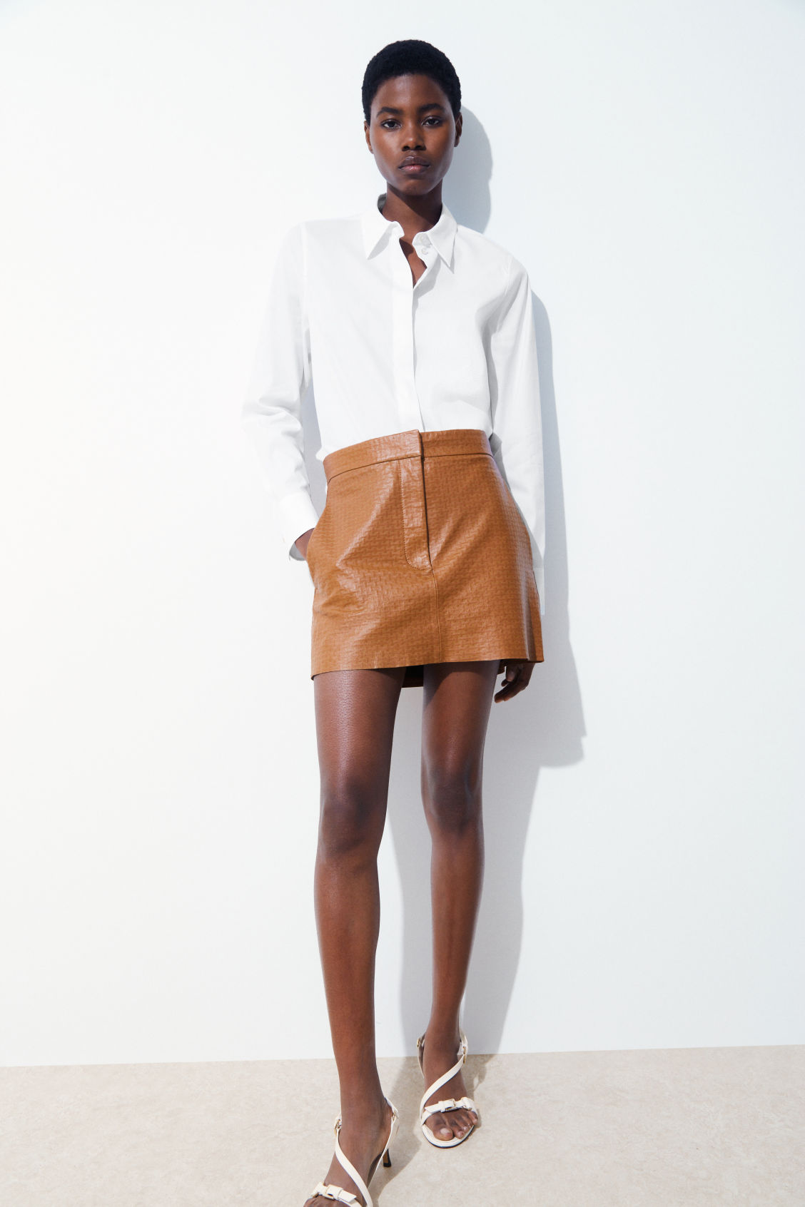THE EMBOSSED-LEATHER MINI SKIRT