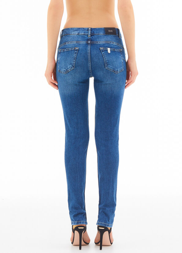 Jeans skinny con applicazioni gioiello