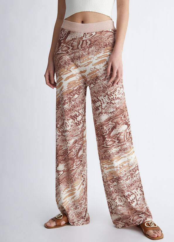 Pantaloni con stampa pitonata