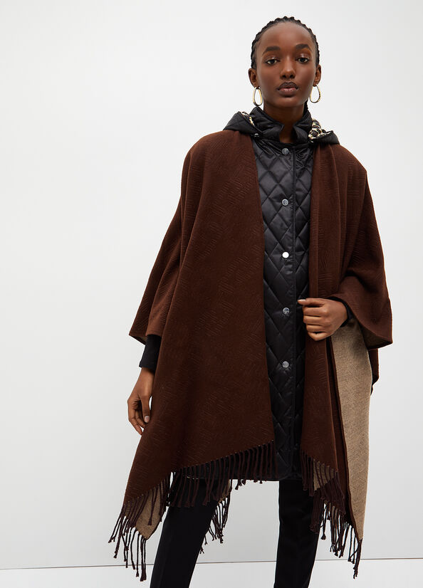 Poncho con logo e frange