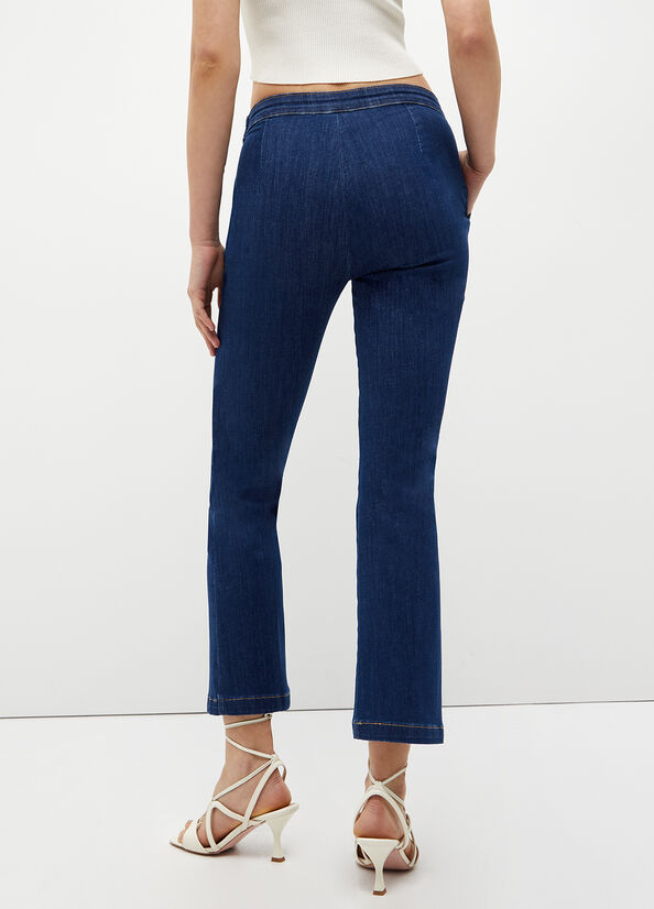 Jeans cropped con accessorio gioiello