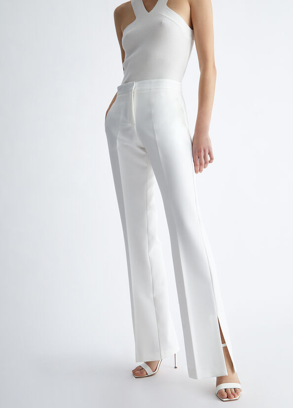 Pantaloni eleganti bianchi con spacchetto