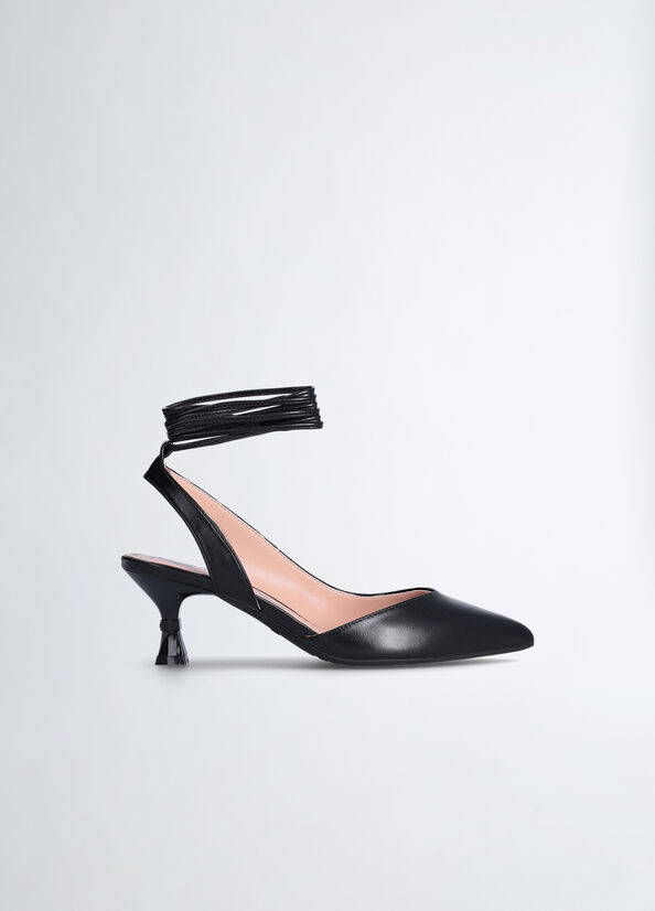 Sling back con tacco a clessidra