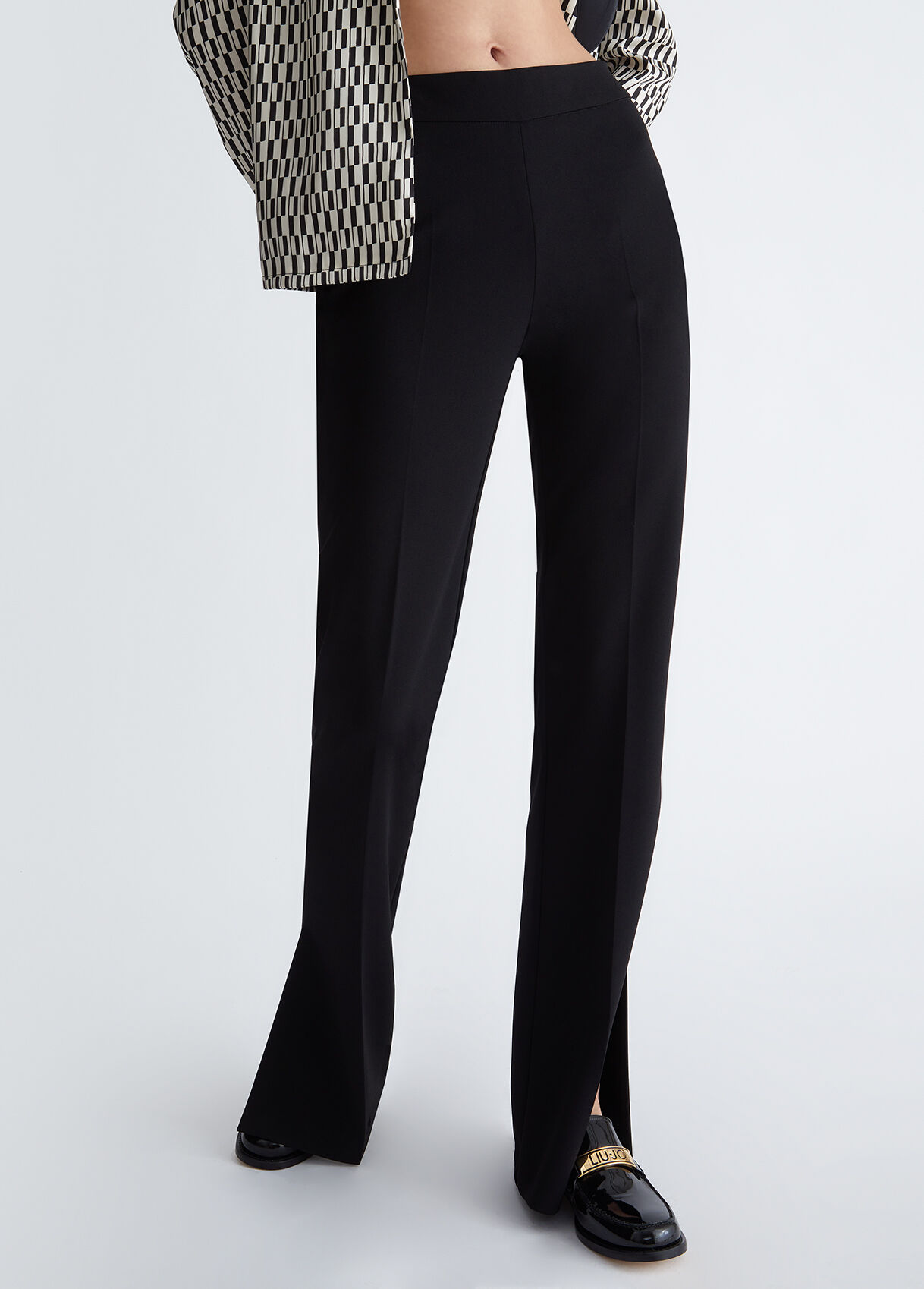 Flared trousers with slits
